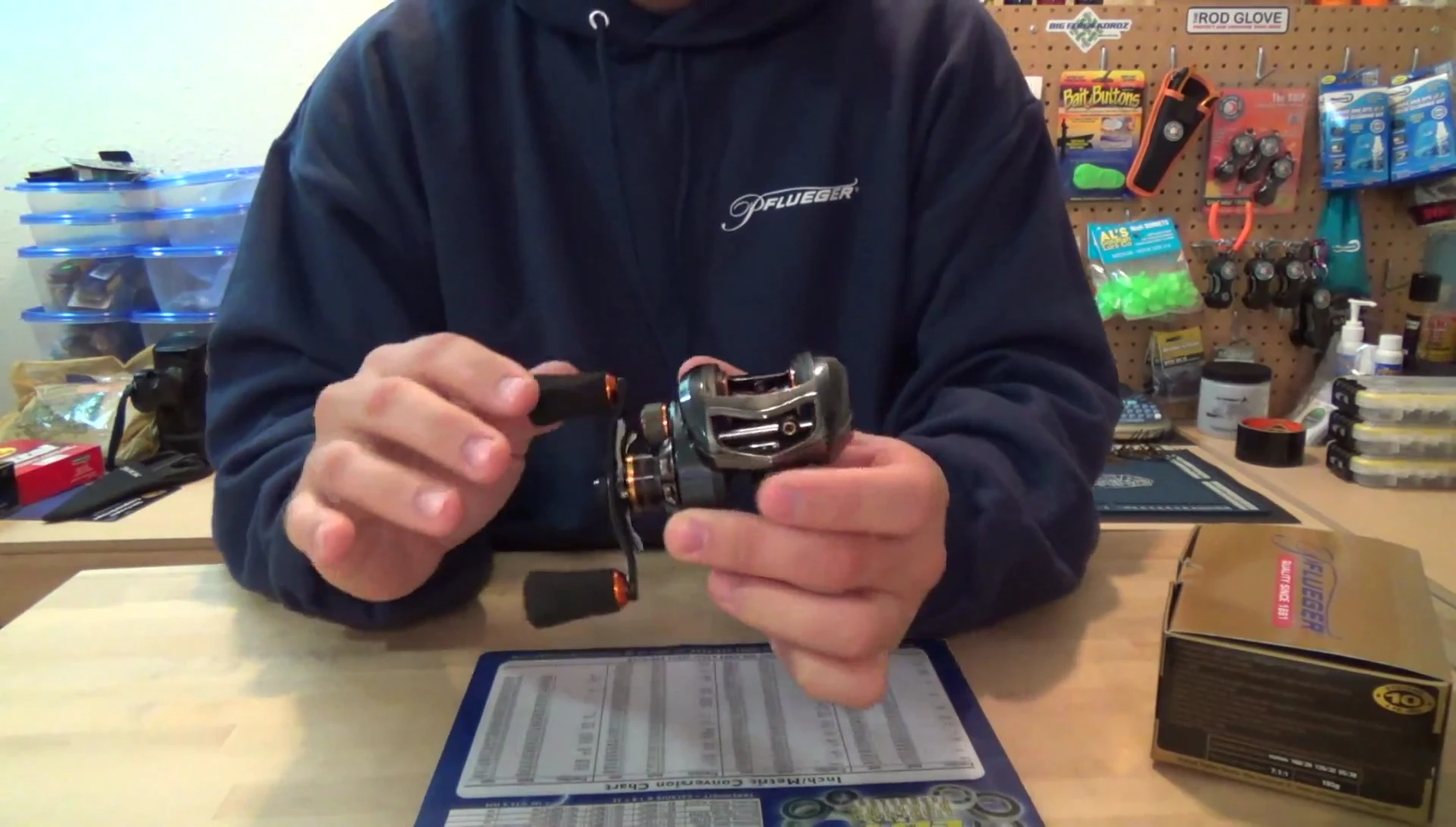 Close-up of the reel showing its blue and orange color scheme