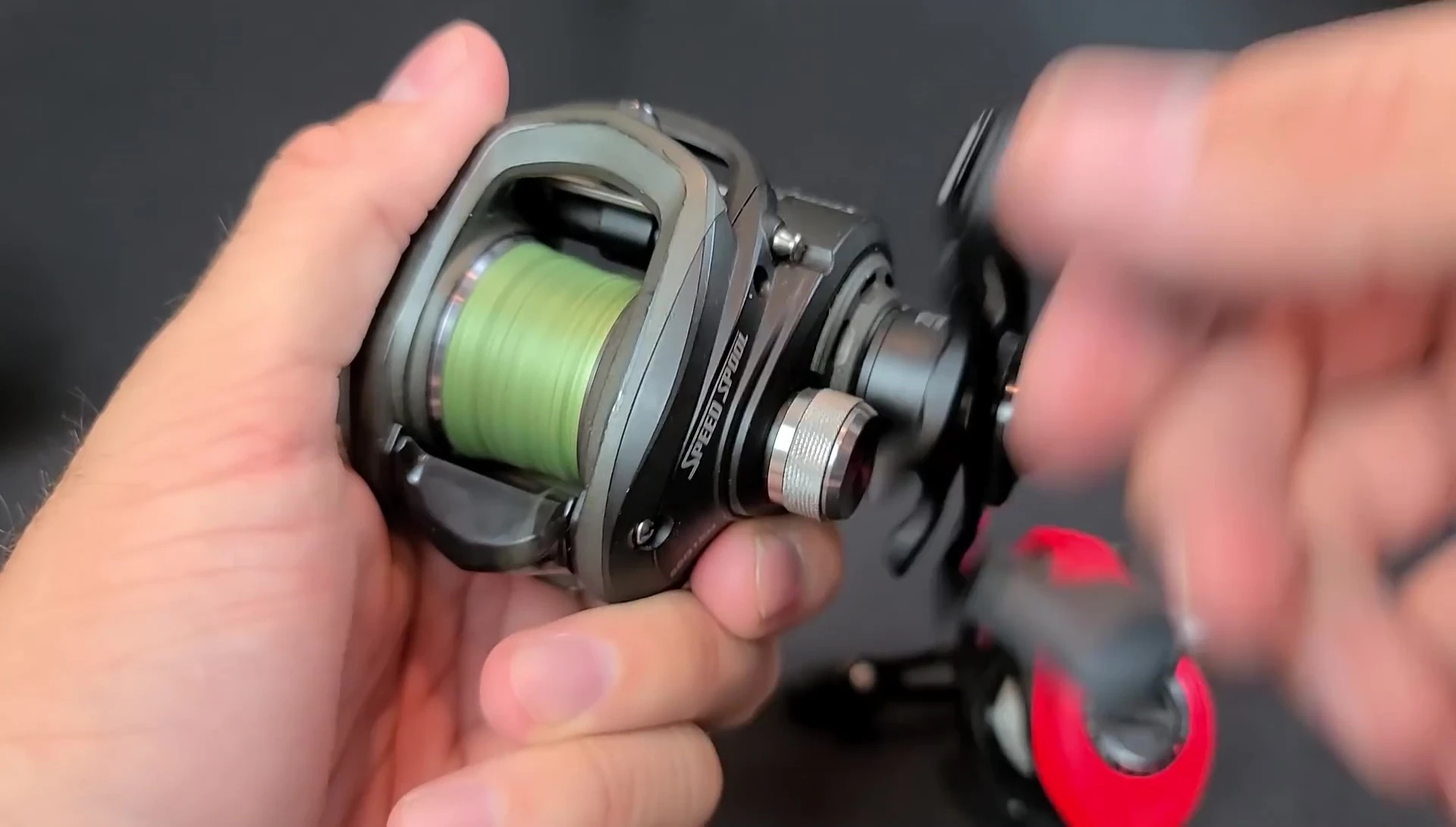 The reviewer shows his well-used Lew's LFS Speed Spool reel.