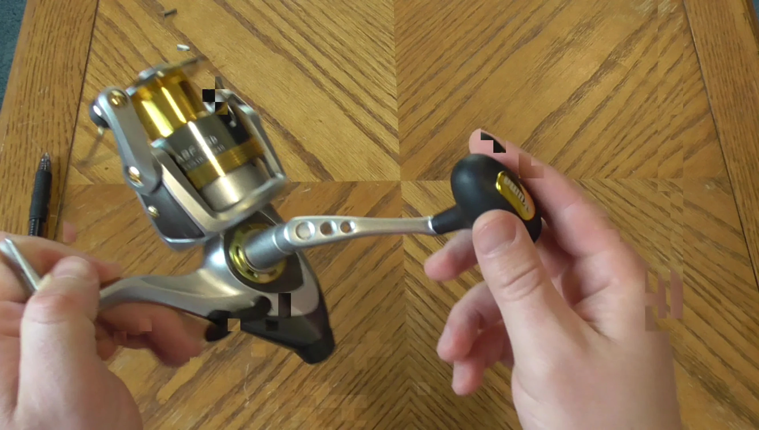 The ergonomic handle of the reel.