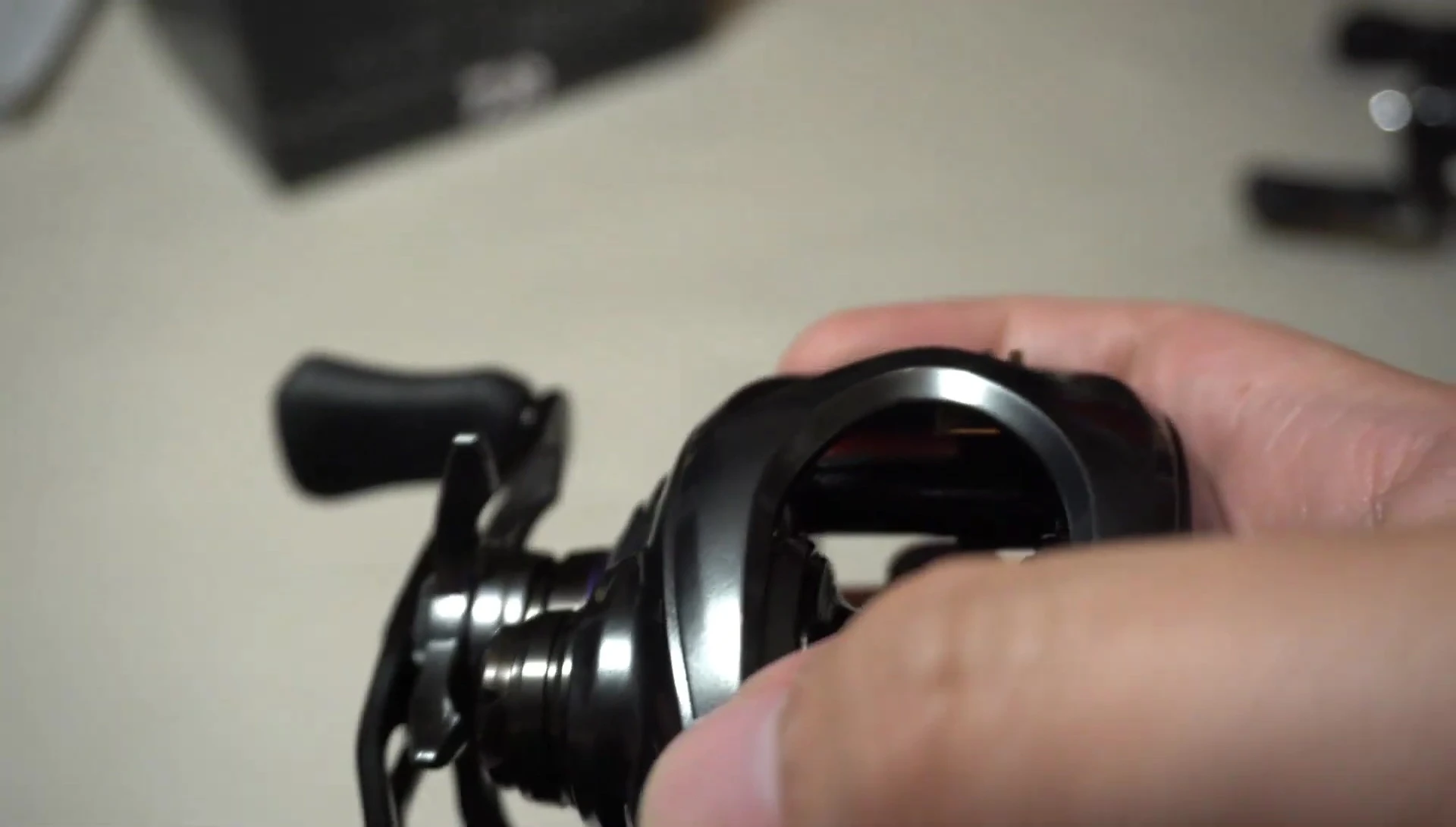Close-up shot highlighting the reel's magnesium construction.