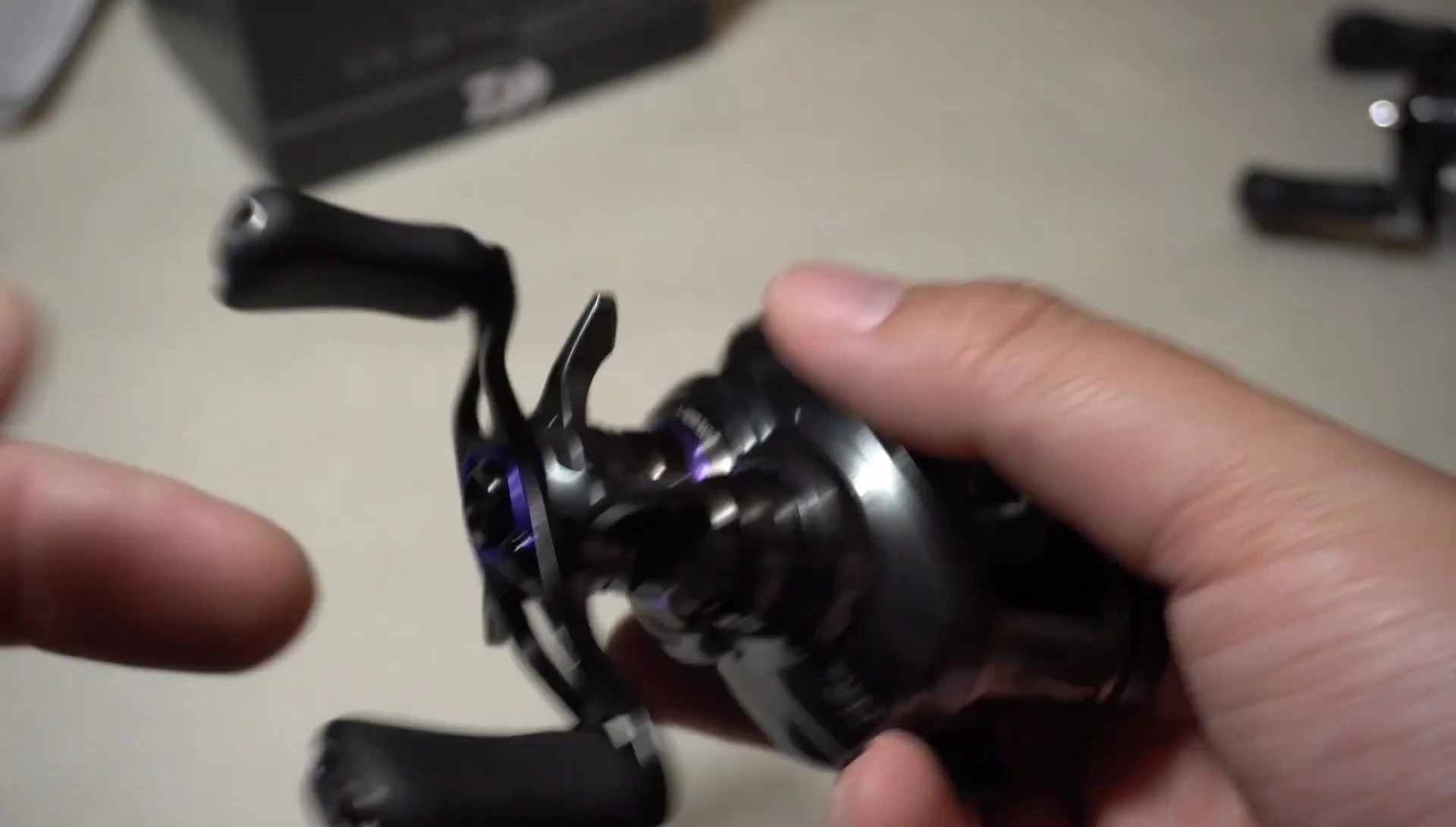 Close-up of the Daiwa Steez CT SV reel highlighting the purple accents indicating the 8:1 gear ratio.