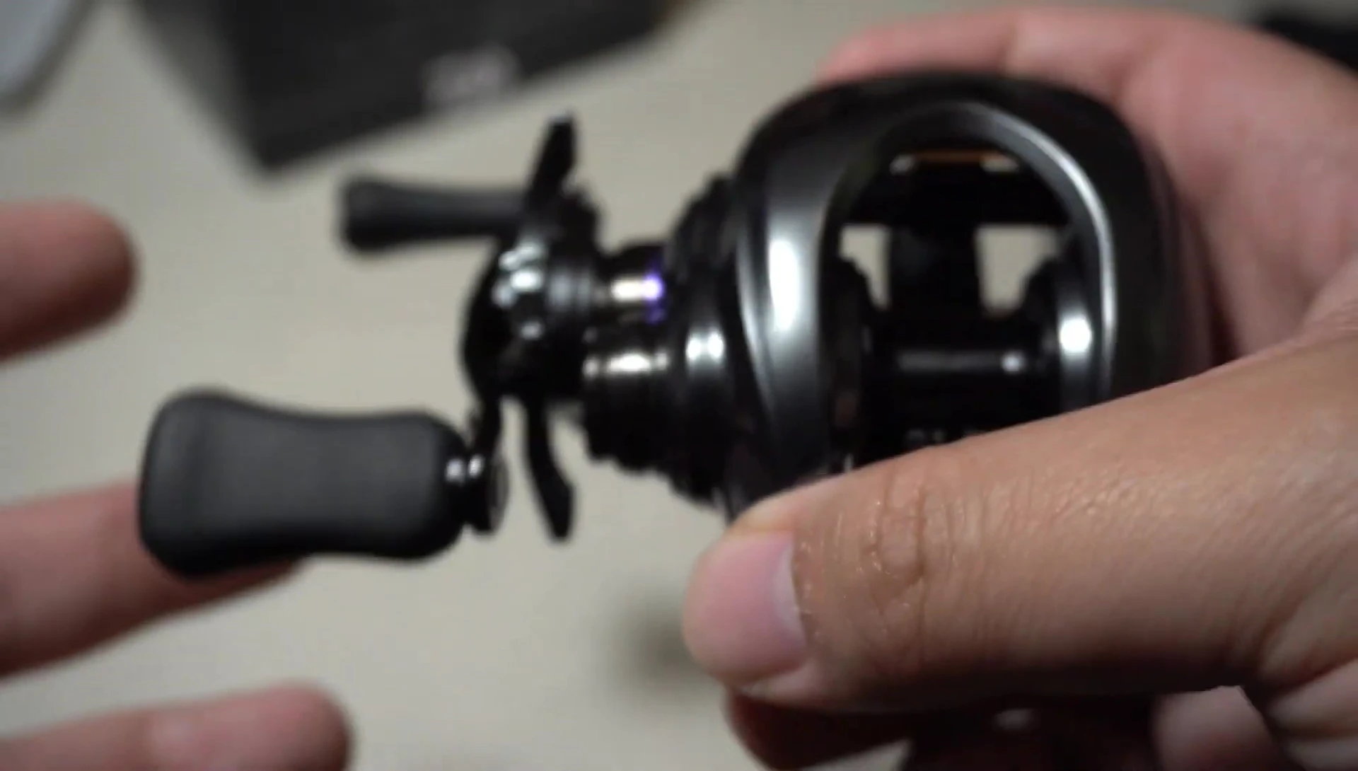 A shot showing the reel being used in a fishing setting, illustrating its applications.
