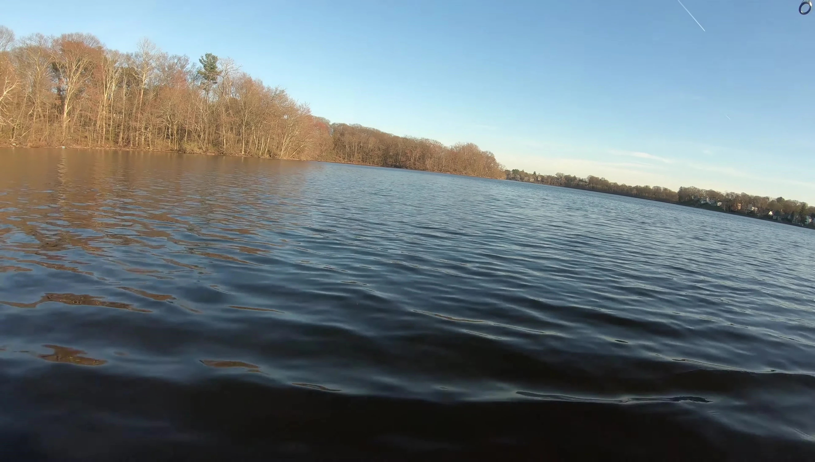 Tester wading in the water, emphasizing the clarity.