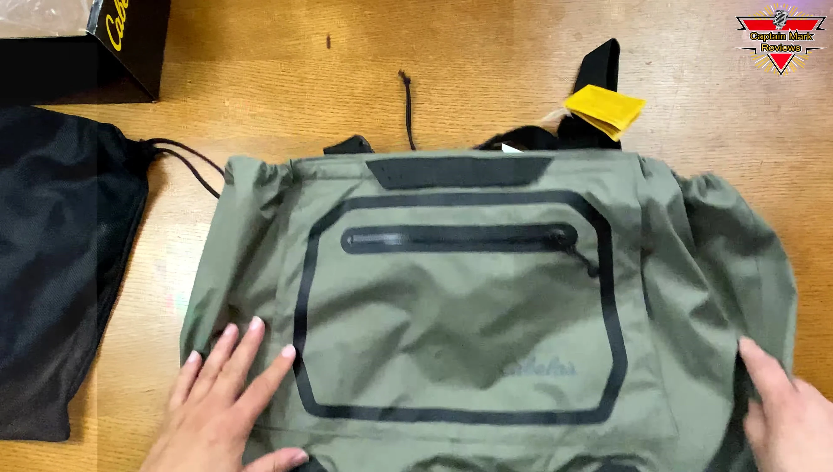 Showing the large front pocket of the waders