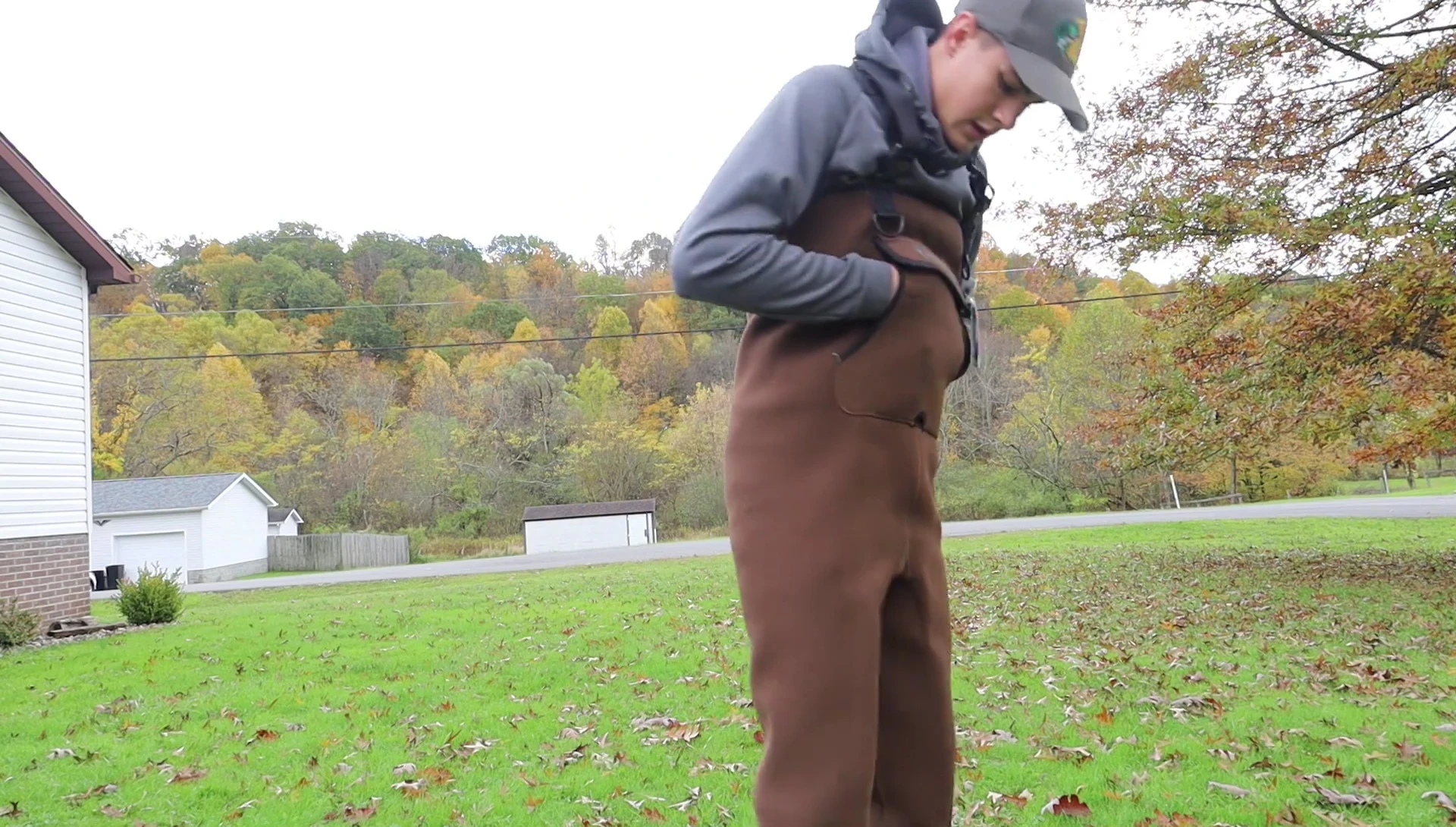 The reviewer trying on the waders.