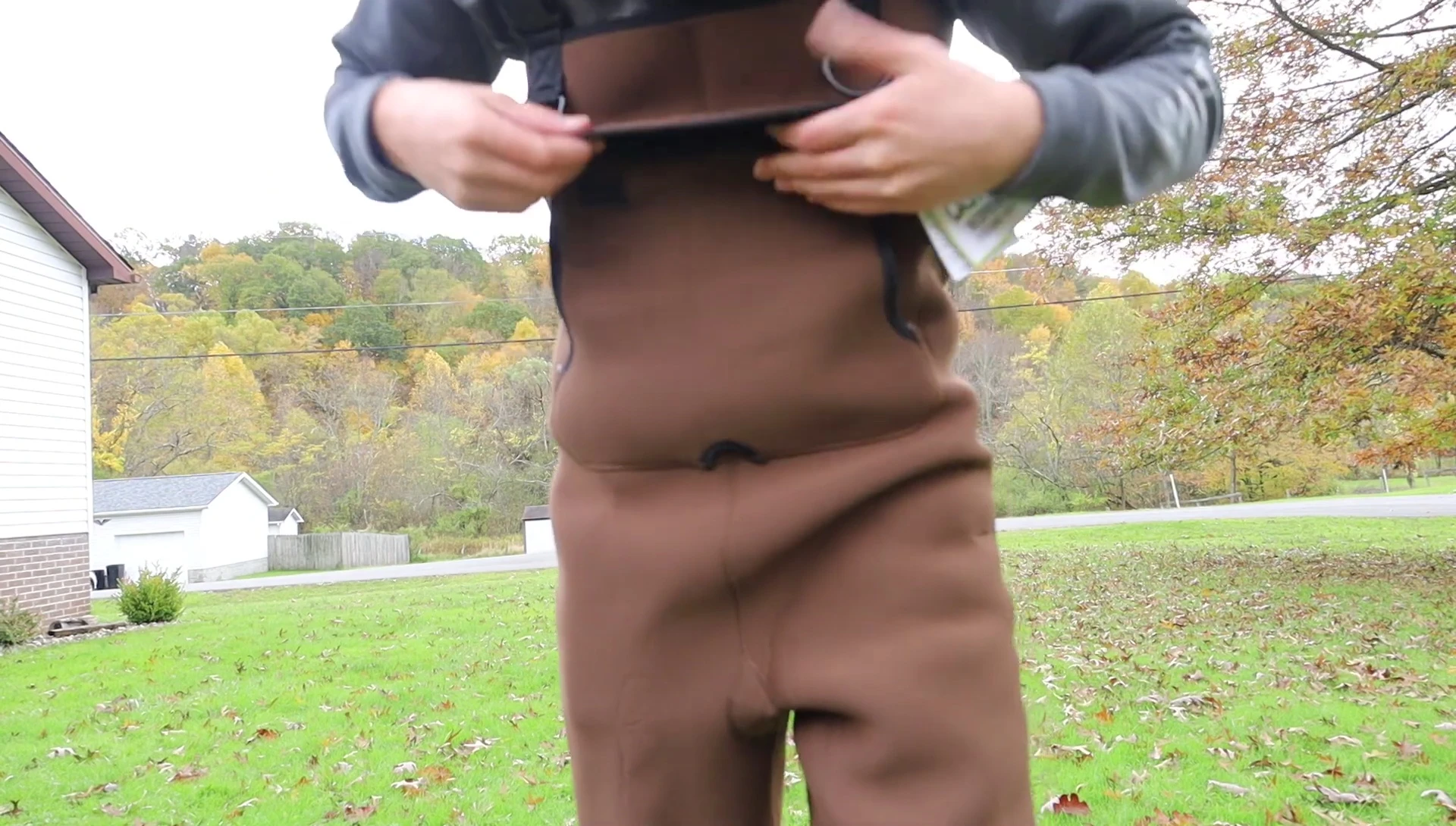 Close-up of the wader's fit around the legs and torso.