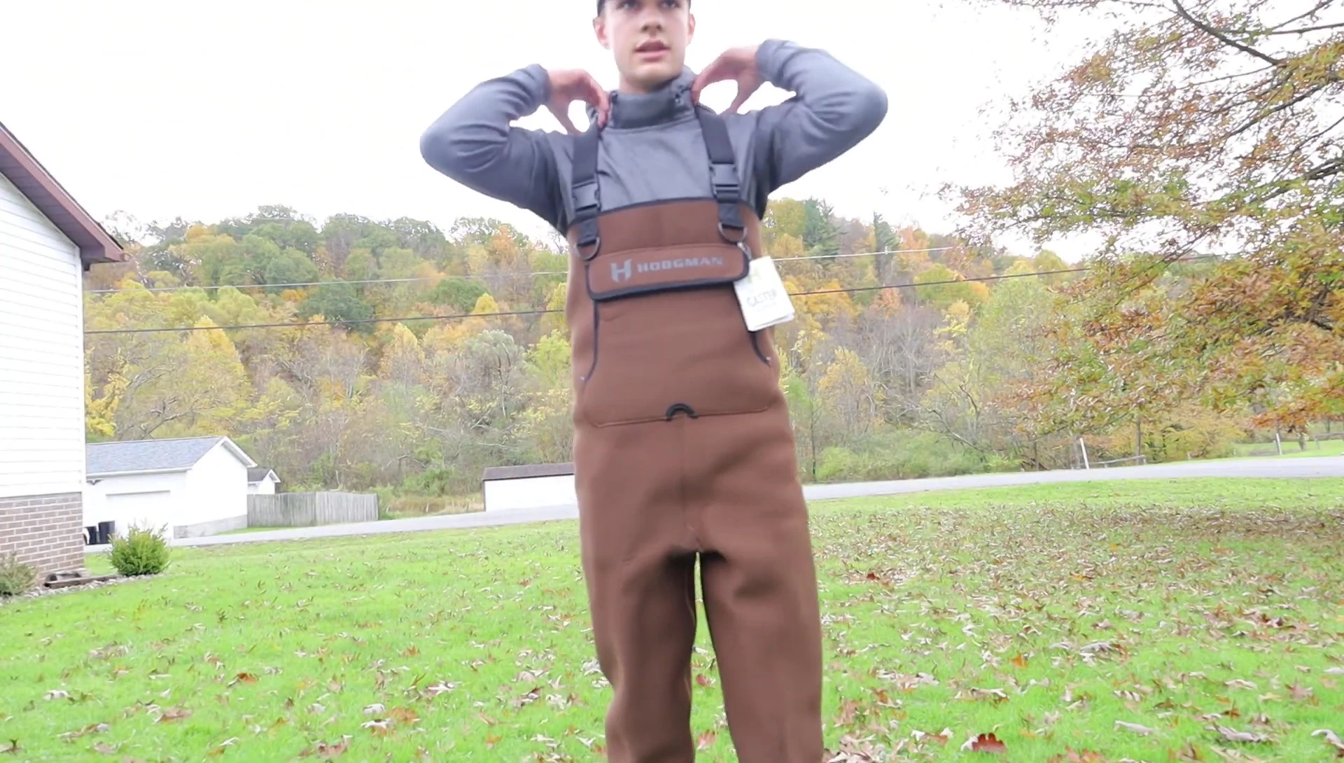 The reviewer demonstrating the adjustability of the straps.