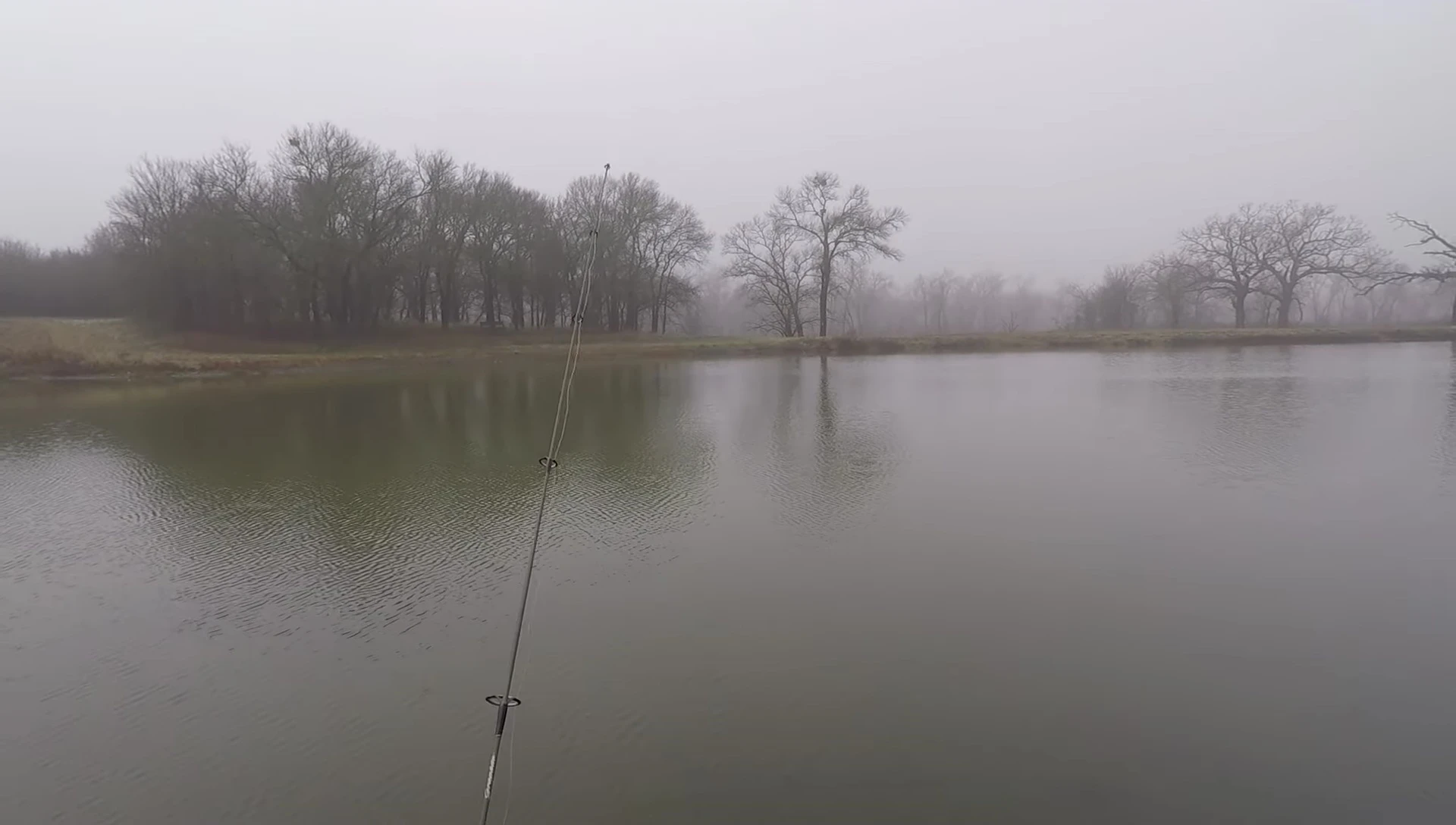 The angler showing the Berkley Drip Minnow attached to the fishing line.
