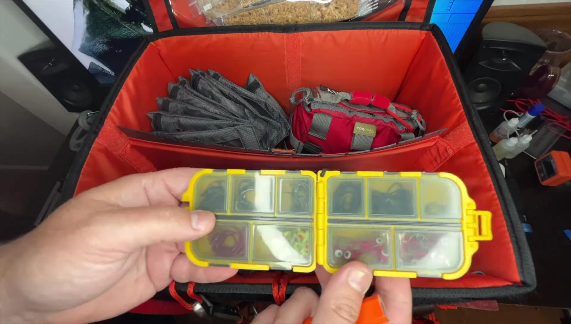 Shot showcasing organized tackle boxes inside the bag.