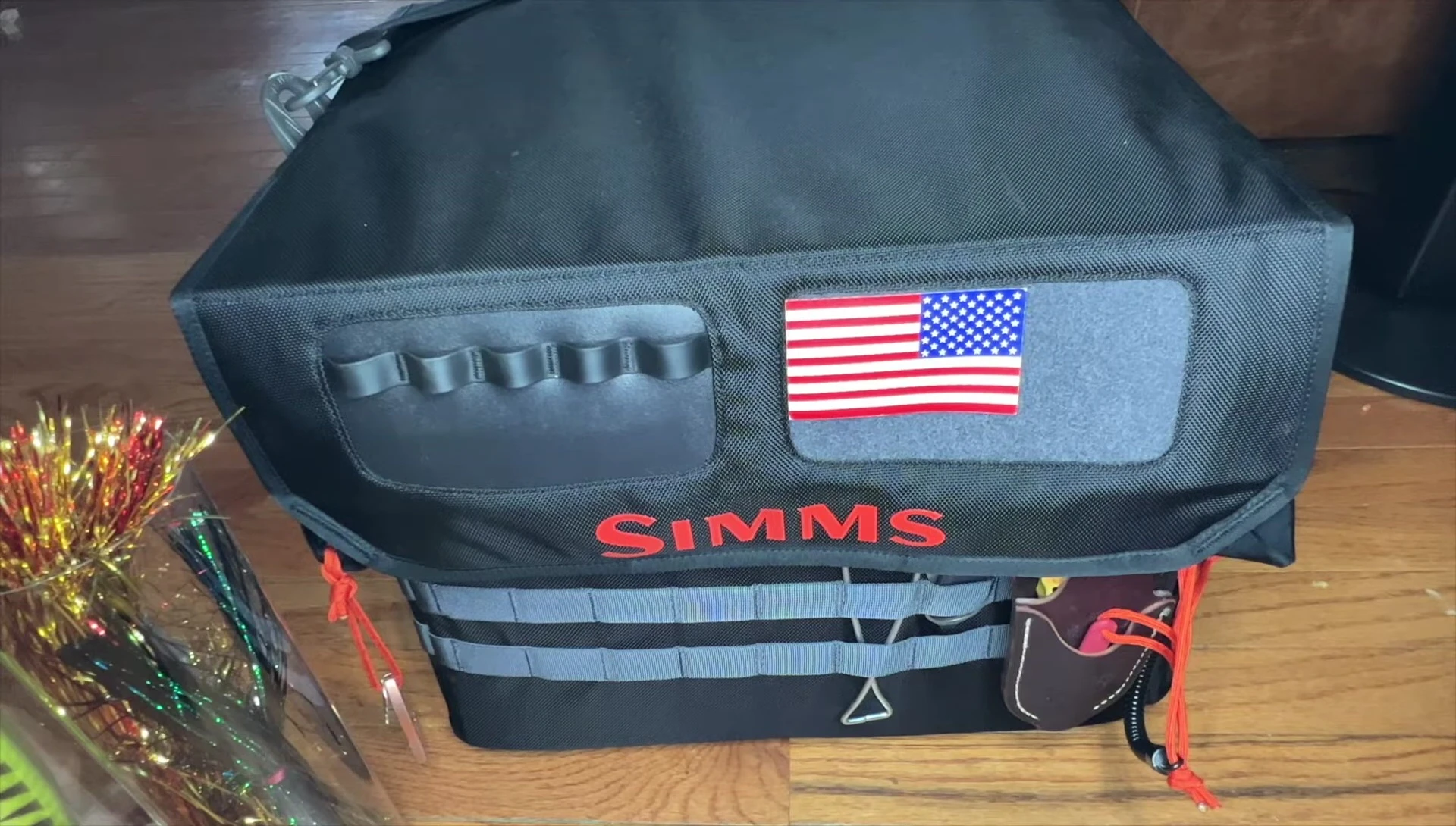 Detailed view of MOLLE webbing and loops on the bag.