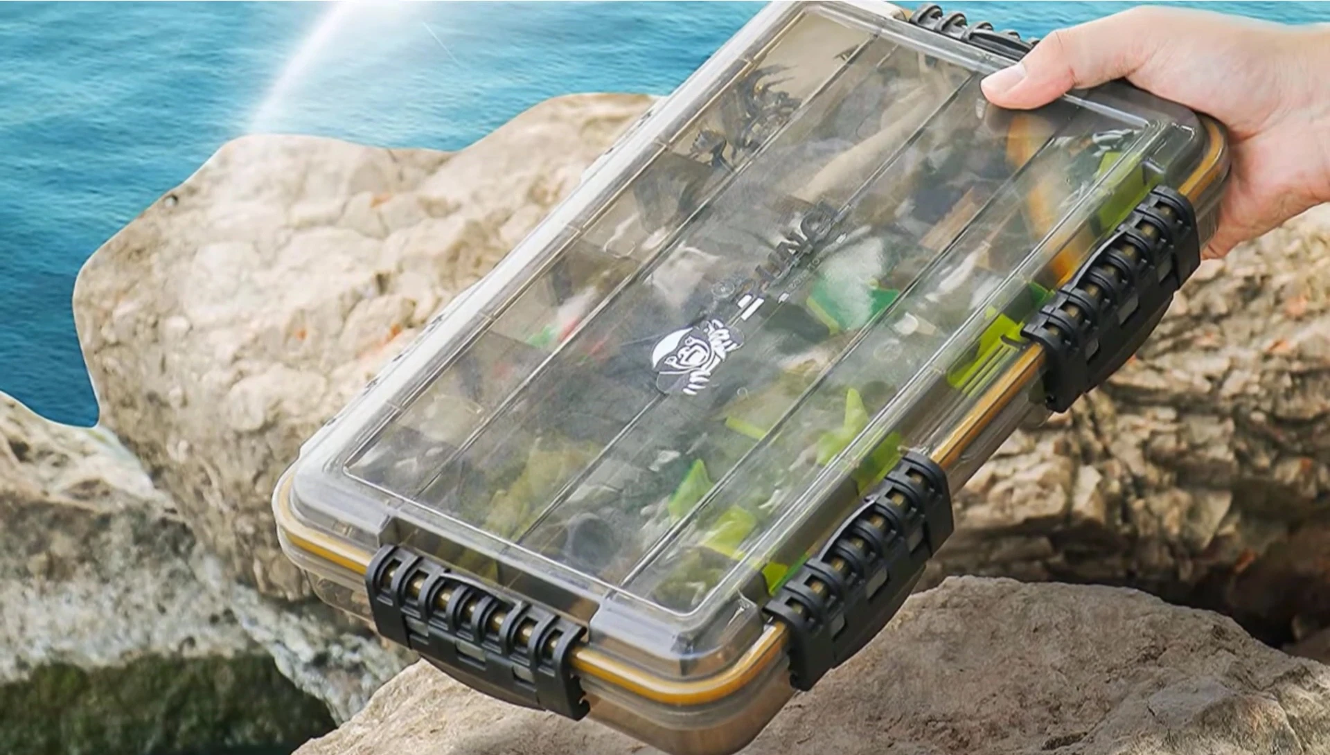 A close-up showing the Runcl Fishing Tackle Box's waterproof seal and interior organization.