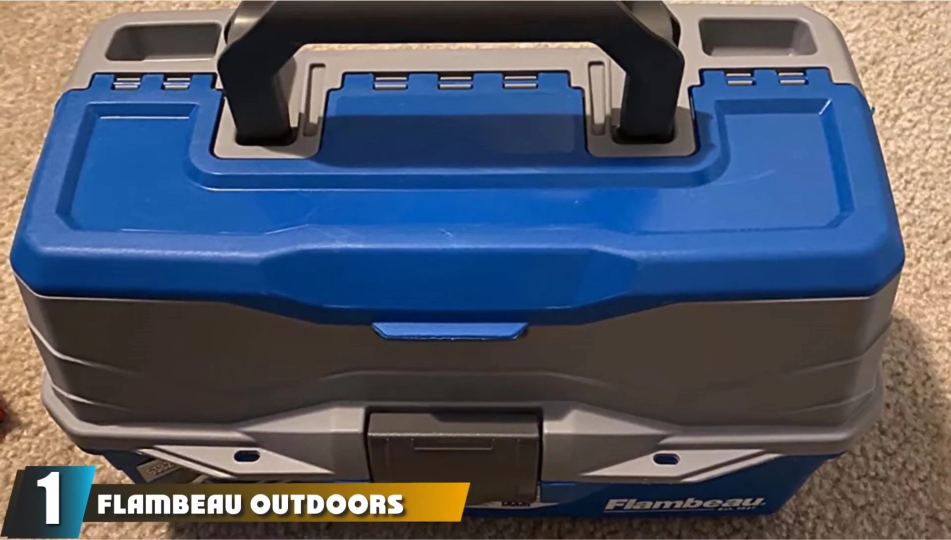 Close-up of the Flambeau 6382 TB tackle box showing its multiple trays and compartments.