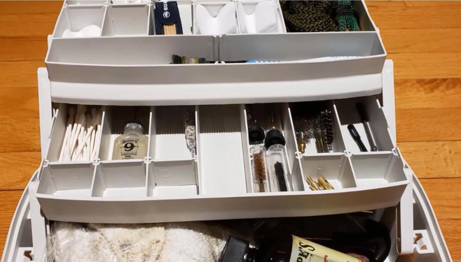 A close-up of the Plano 2-Tray Tackle Box, highlighting its handle and latch.