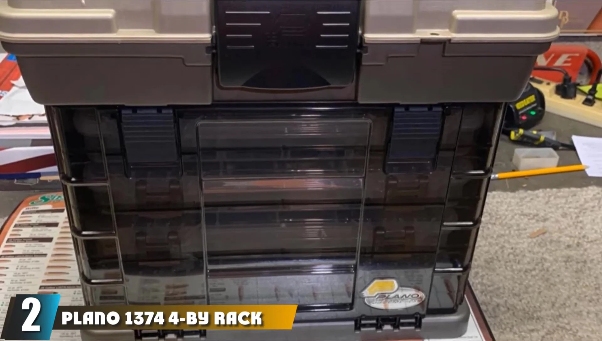 The Plano 1374 tackle box, highlighting its four-rack system and durable design.