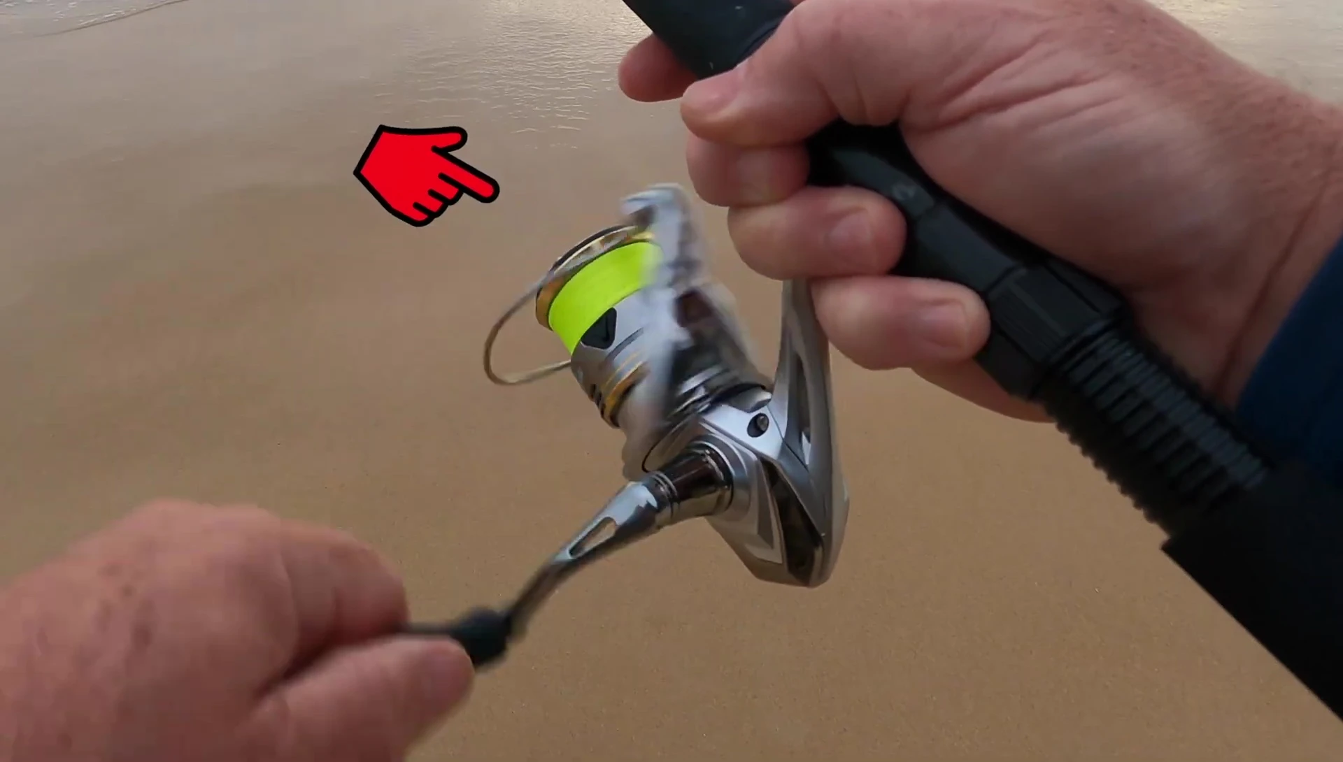 The YouTuber holding the Shimano Sedona reel