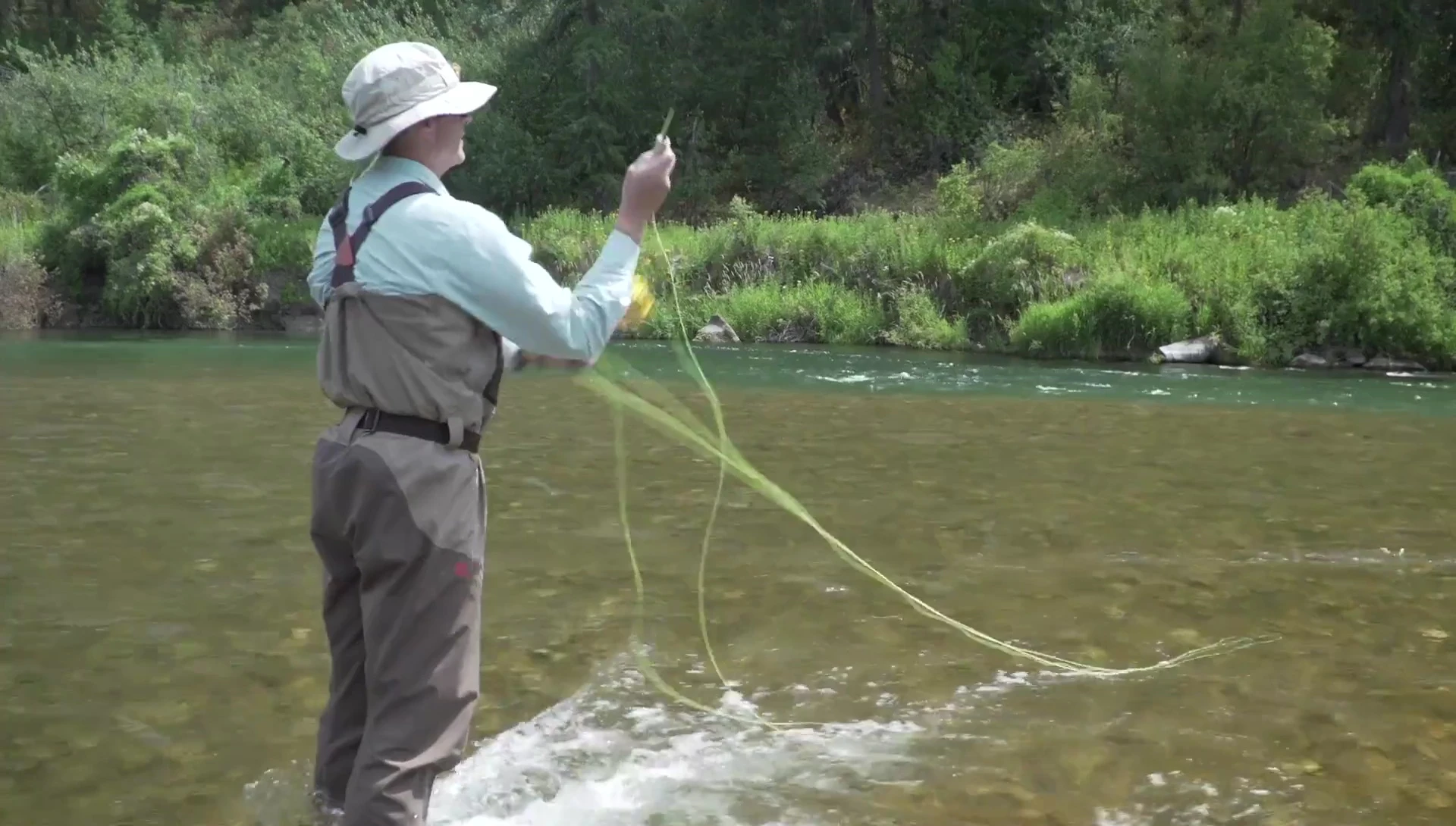 Action shot of someone casting the RIO Powerflex Max Shooting Line.