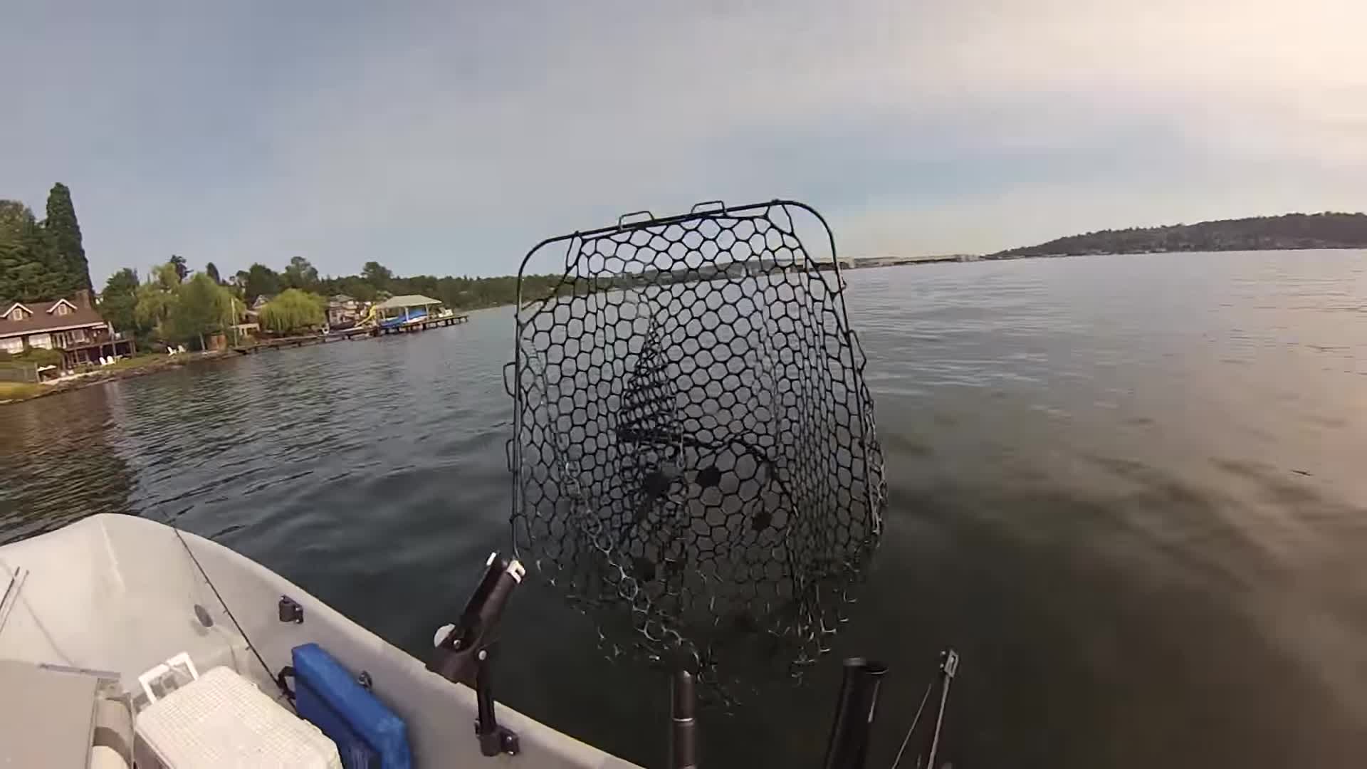 Angler expressing frustration with short-reach nets while Kokanee fishing