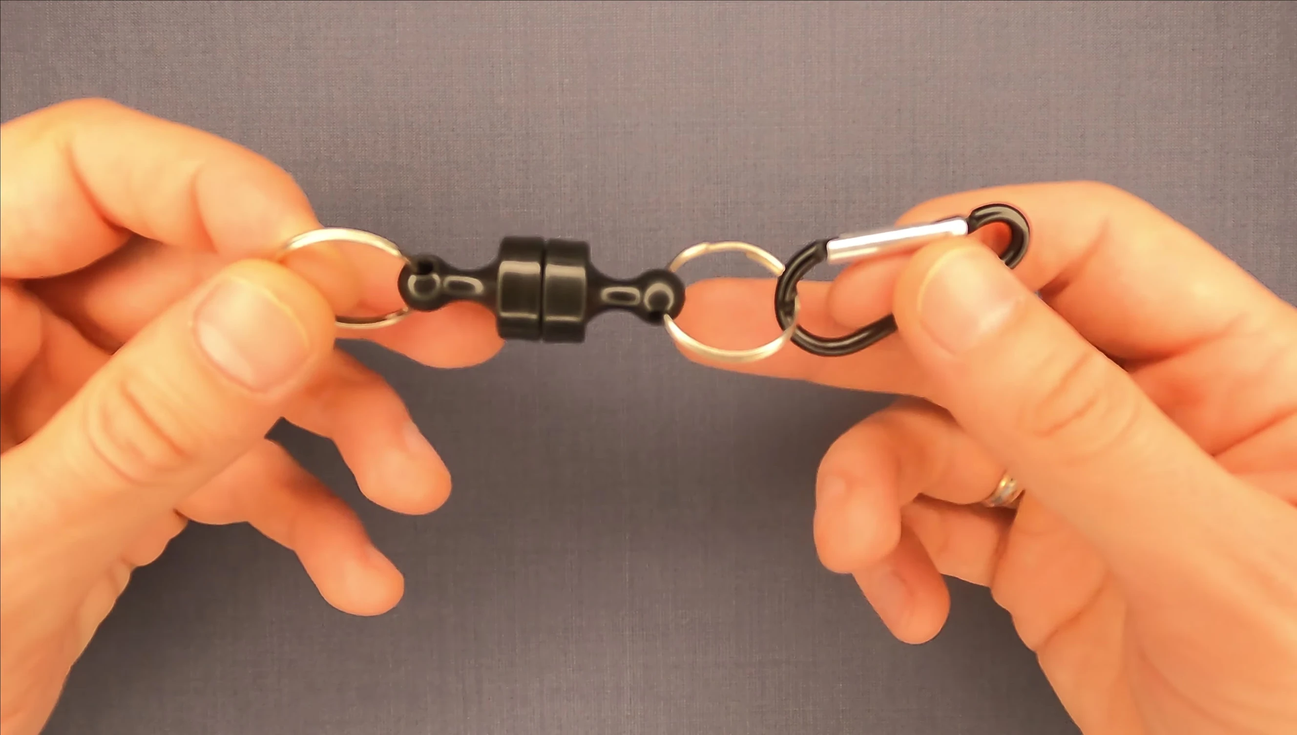 Close-up shot of the magnetic fishing tool showing its length.