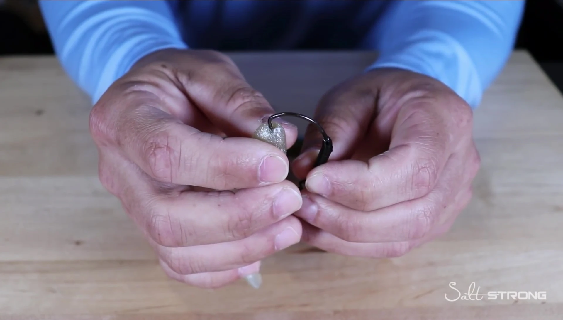 Demonstrating the rigging process on a Z-Man lure
