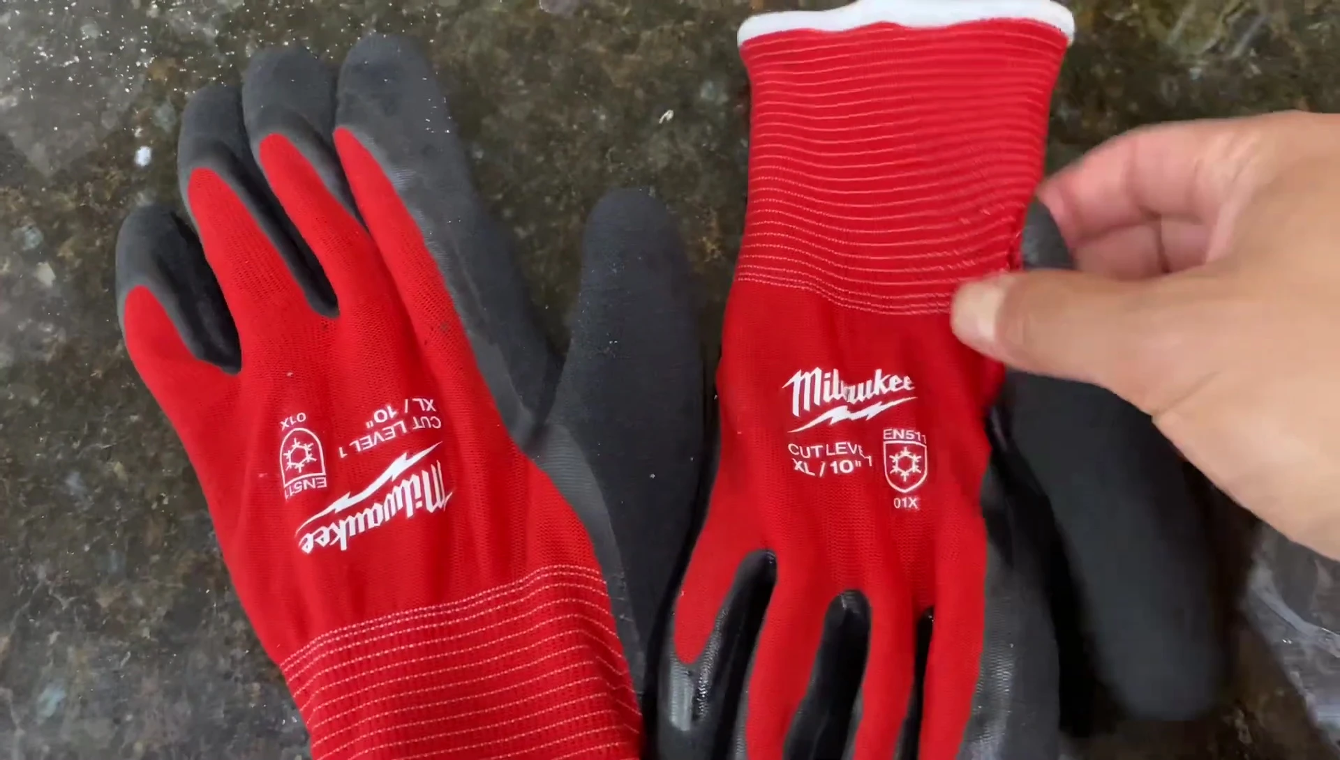 Close-up of the Milwaukee gloves being held.
