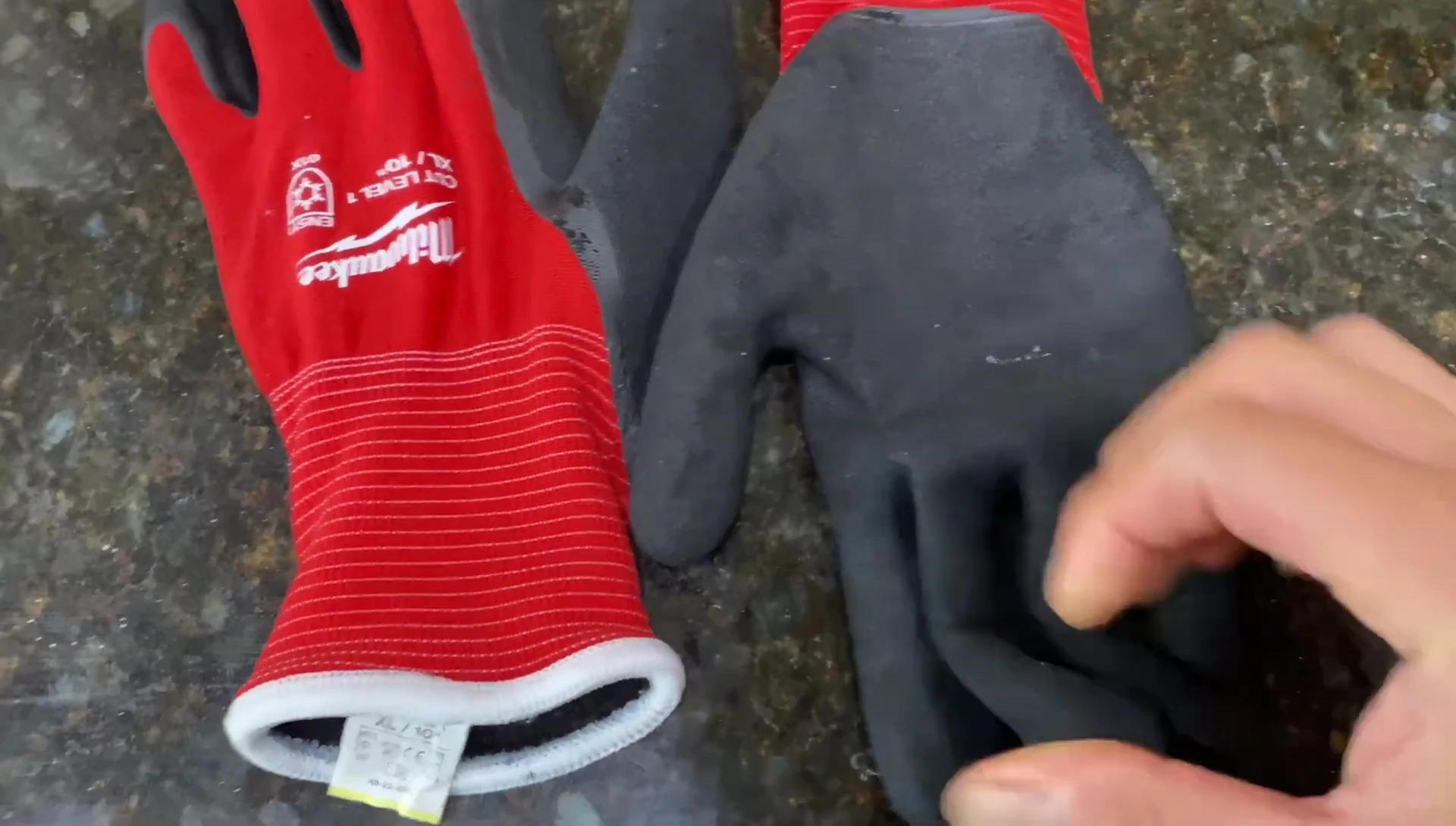 Gloves demonstrating waterproof feature.