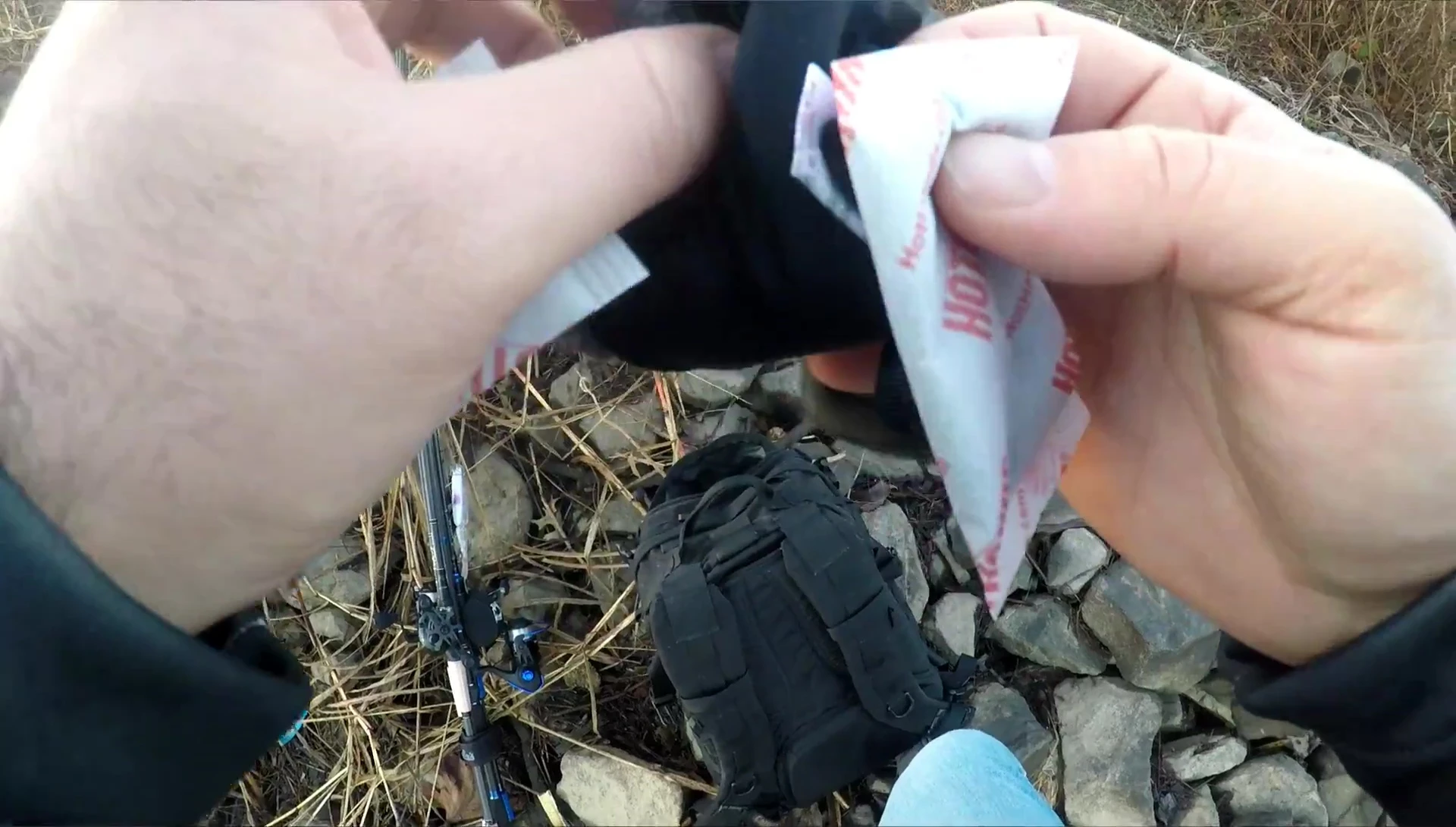 Highlighting the hand warmer pocket on the gloves