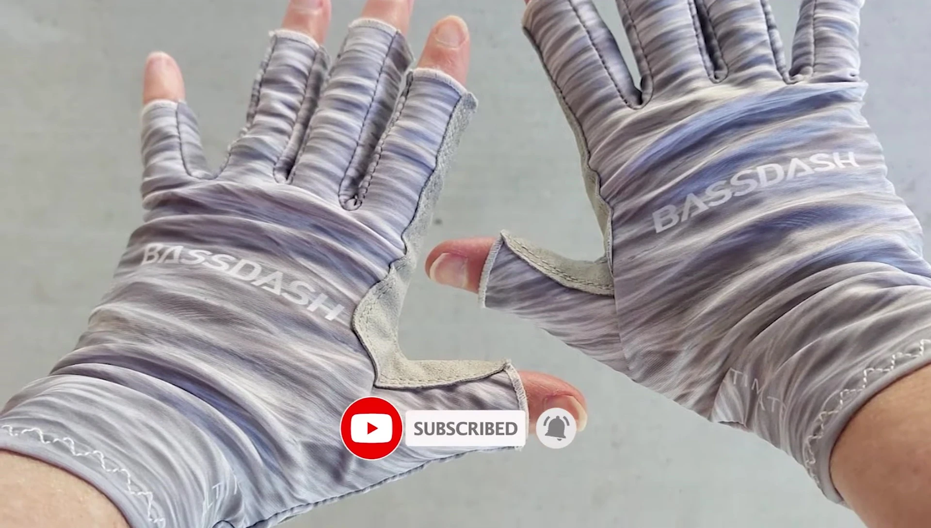Person wearing Bass Dash gloves, demonstrating grip