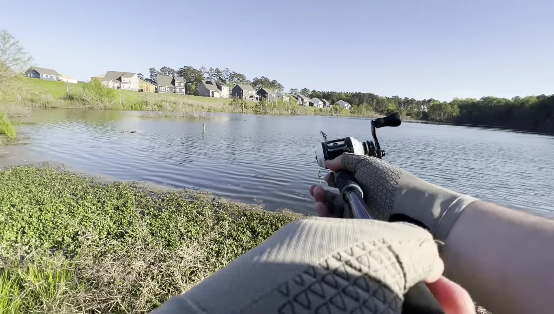 The reviewer holding the gloves and commenting on the feel and fit.