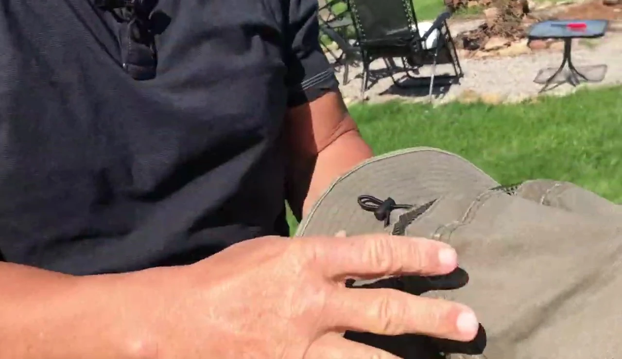 The speaker mentioning dunking the hat in water for cooling.