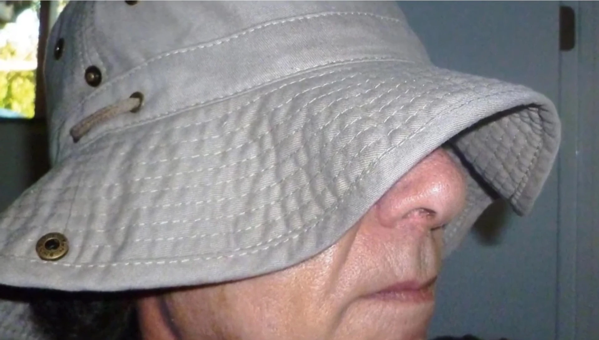 Close-up showcasing the wide brim and adjustable snap