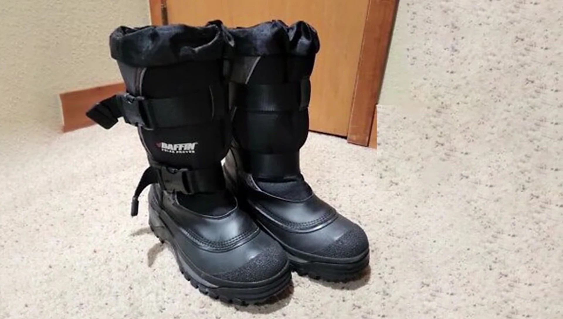 Close-up shot of the ankle and calf area highlighting the buckles and snow collar.