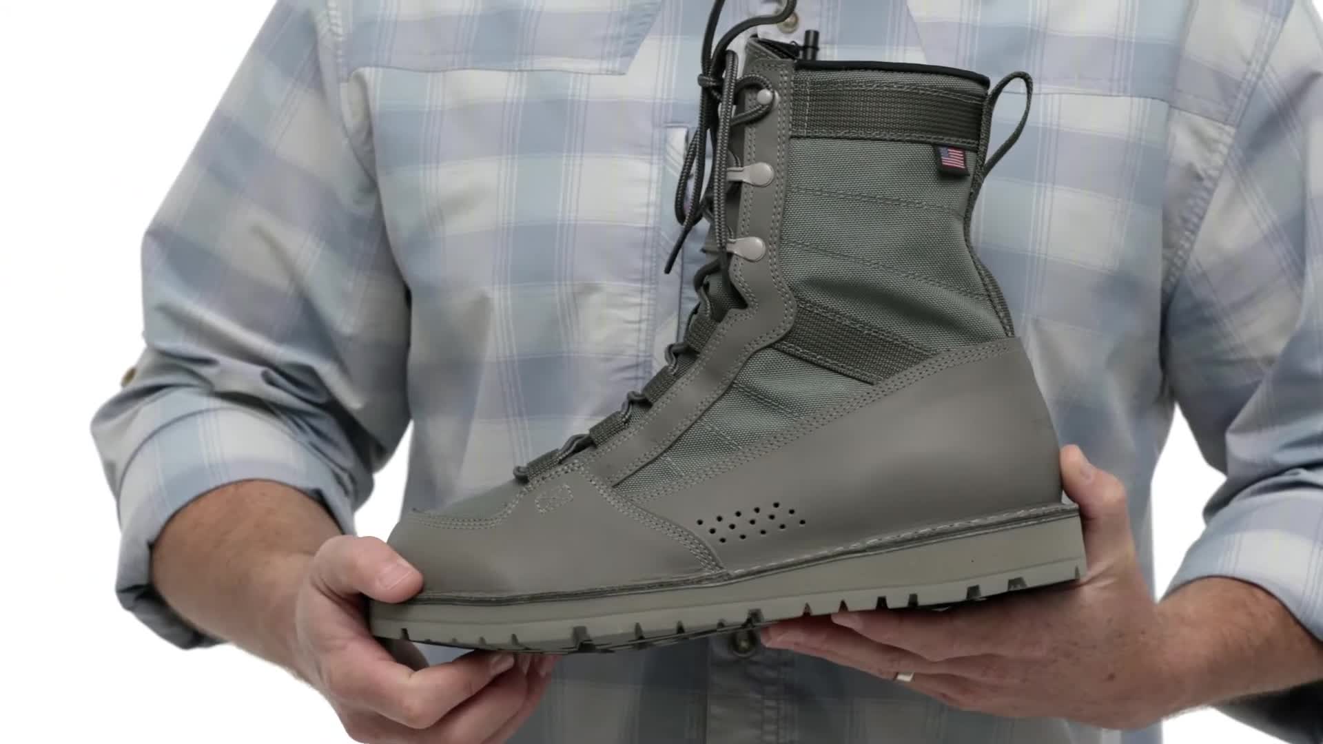 A shot showcasing the boots being held and admired.