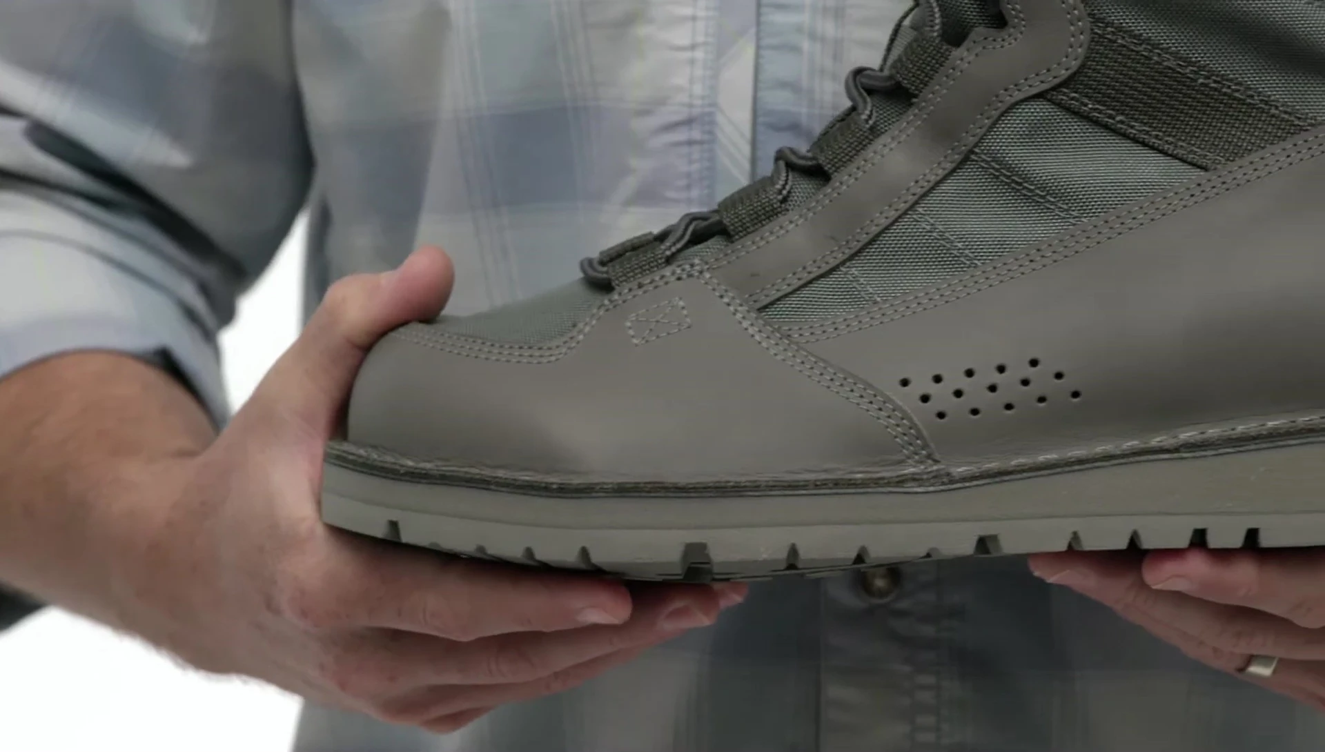 Close-up showcasing the leather and nylon materials of the boot.