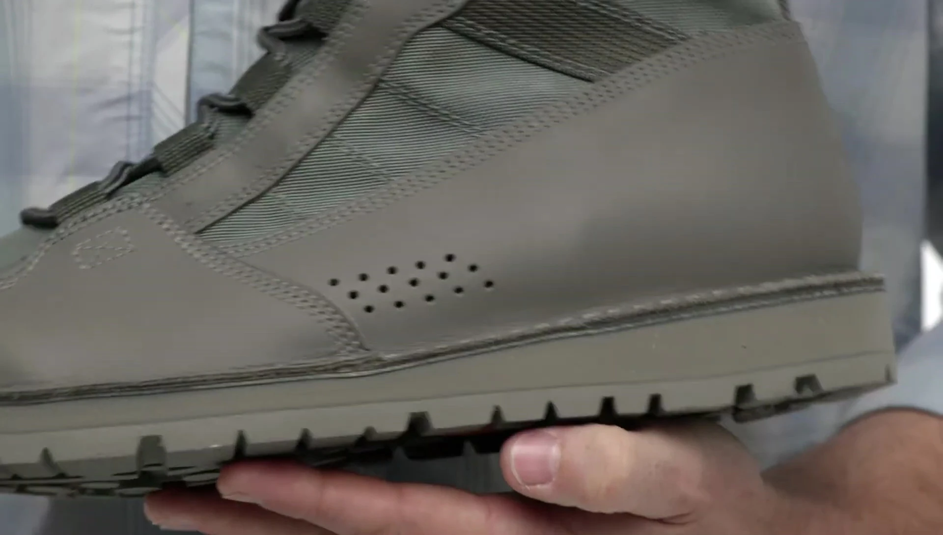 Shot emphasizing the drainage holes of the boot.