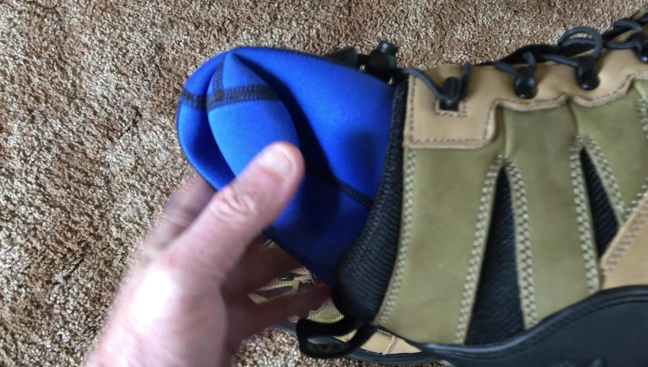 The reviewer showcasing the boots with wet socks