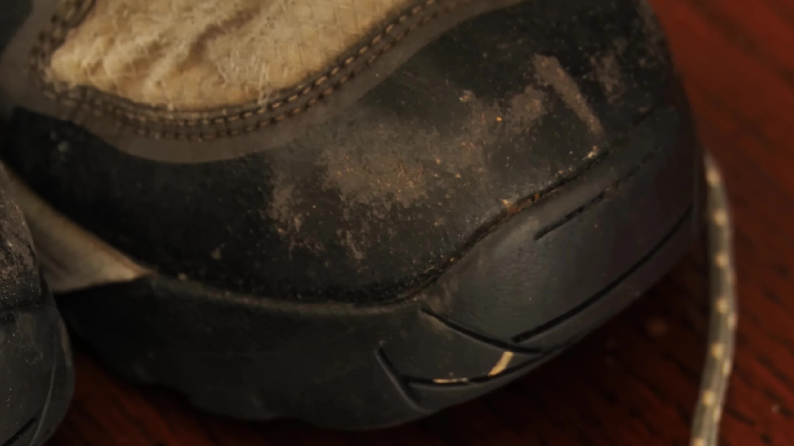 Close-up of the upper fabric showing minor wear and tear.