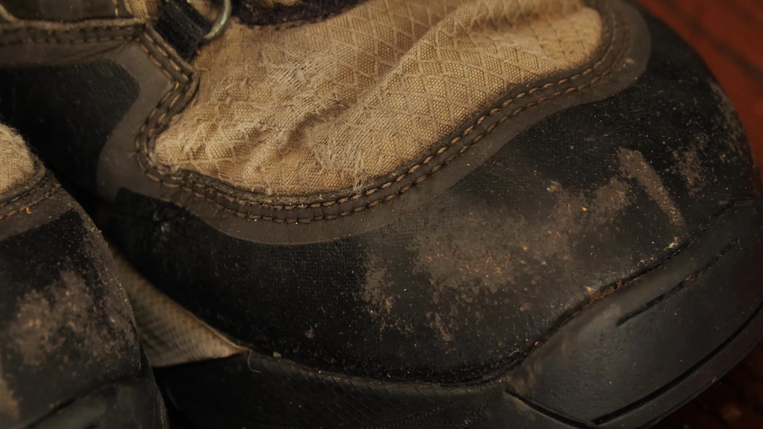 A shot illustrating the boots being dragged on rocks.