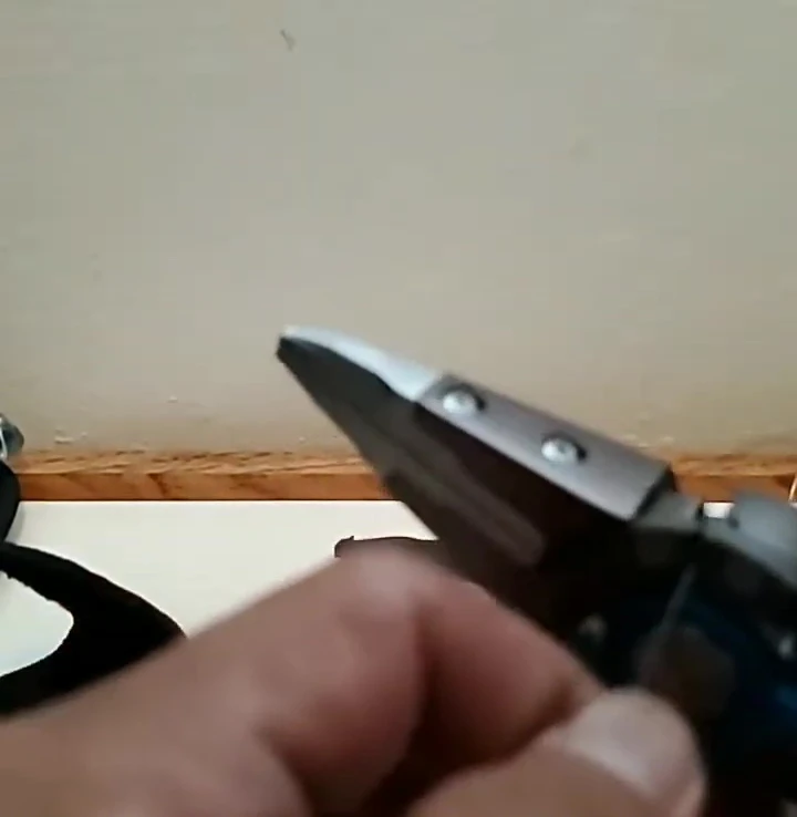 The Gerber Magniplier successfully cutting fishing line.