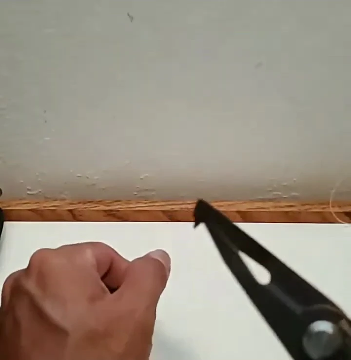 The Shimano Power Plier easily cutting through fishing line.