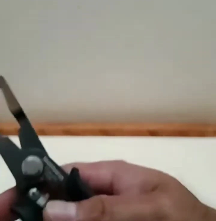 The Shimano Power Plier demonstrating its cutting ability.
