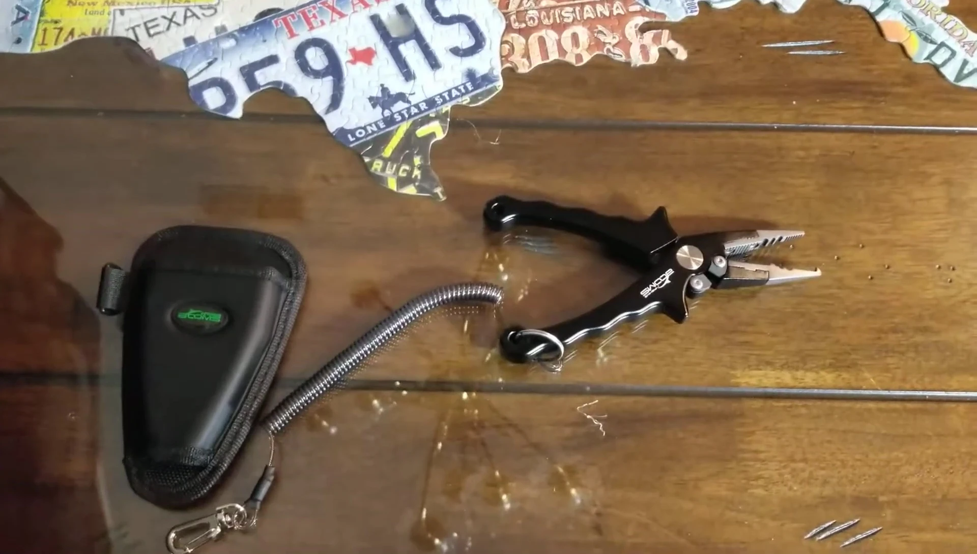 The pliers with the lanyard attached.