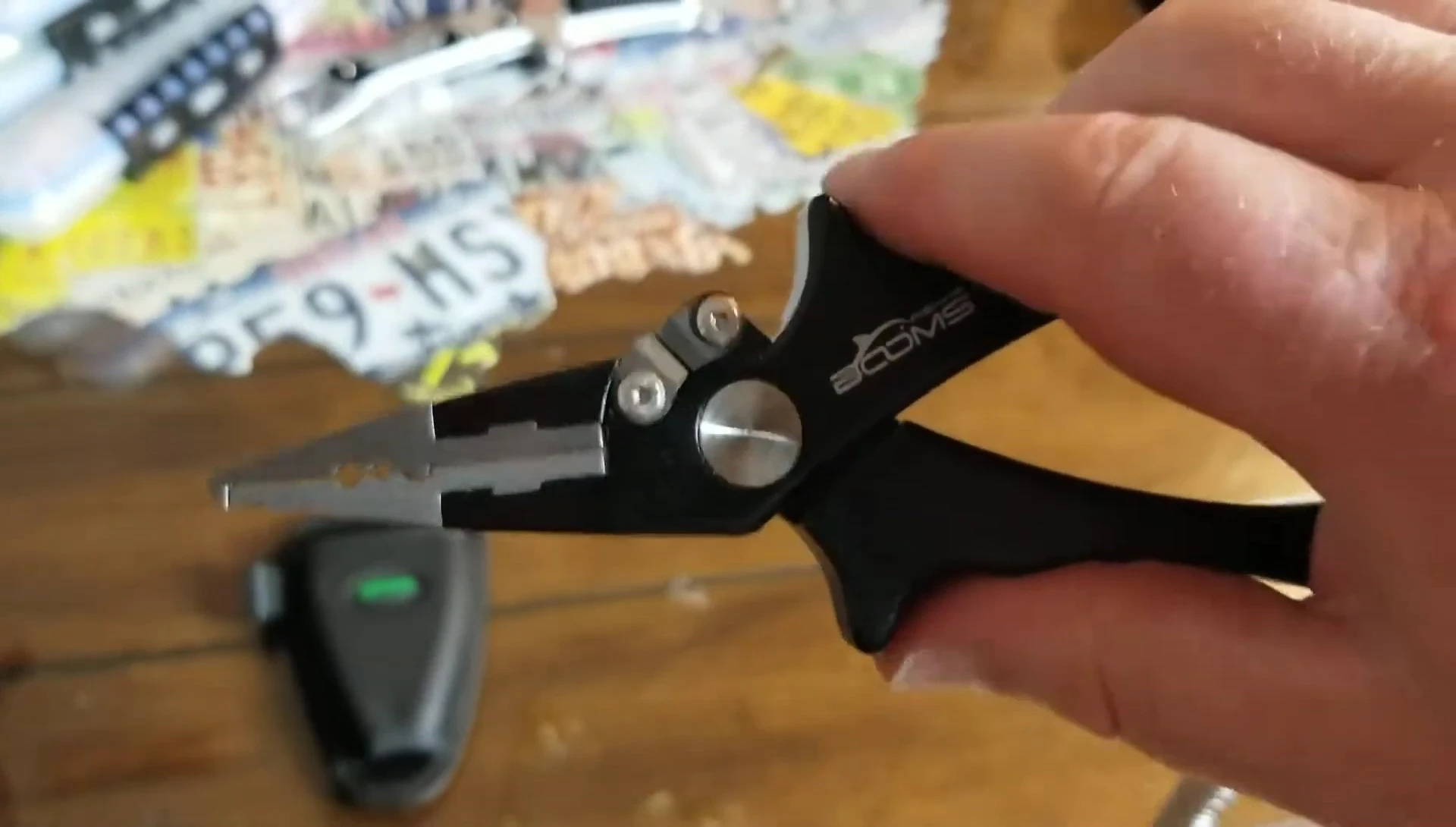 Hand holding the pliers, showcasing the comfortable grip.