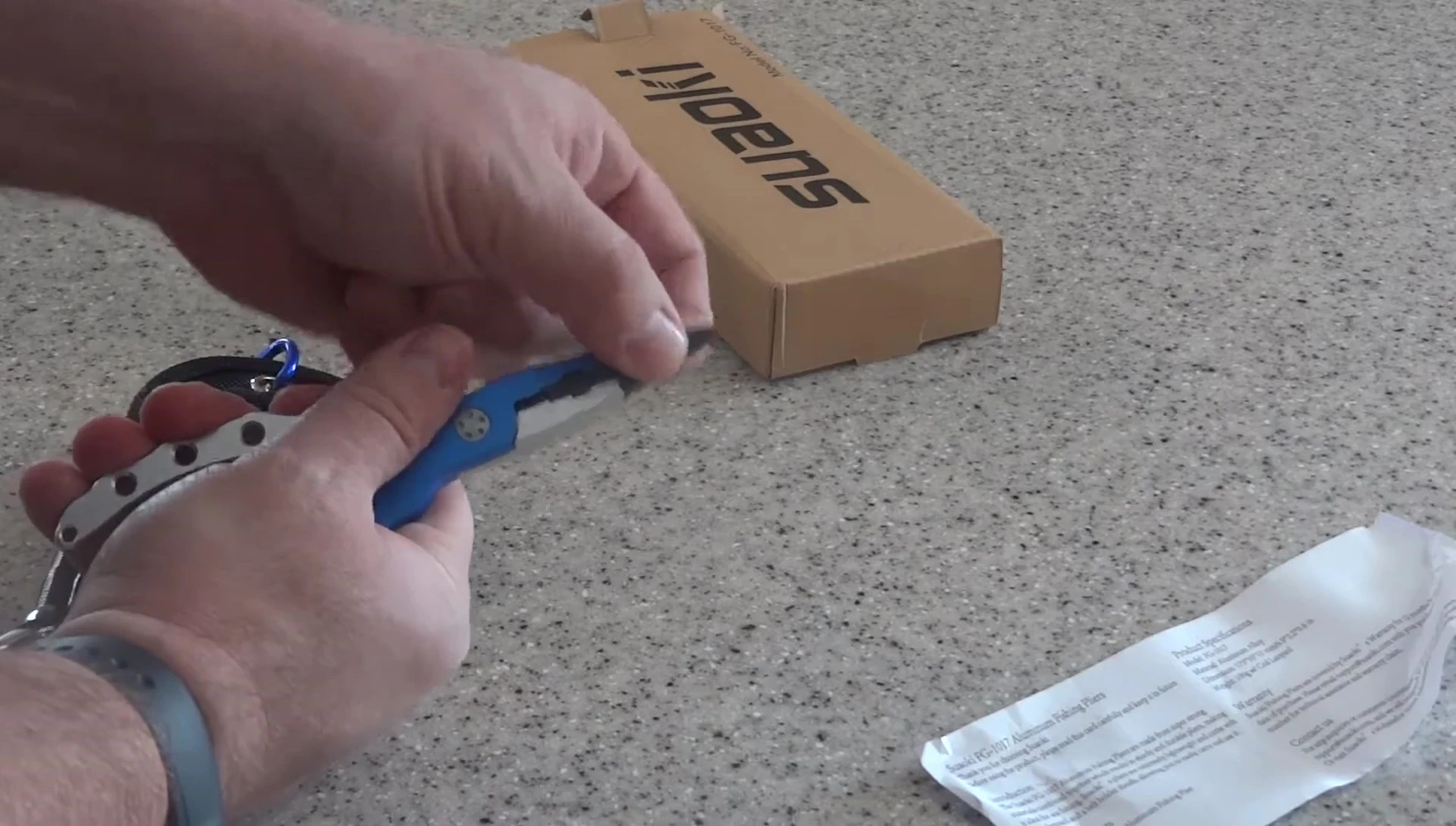 Pliers gripping a fishing line