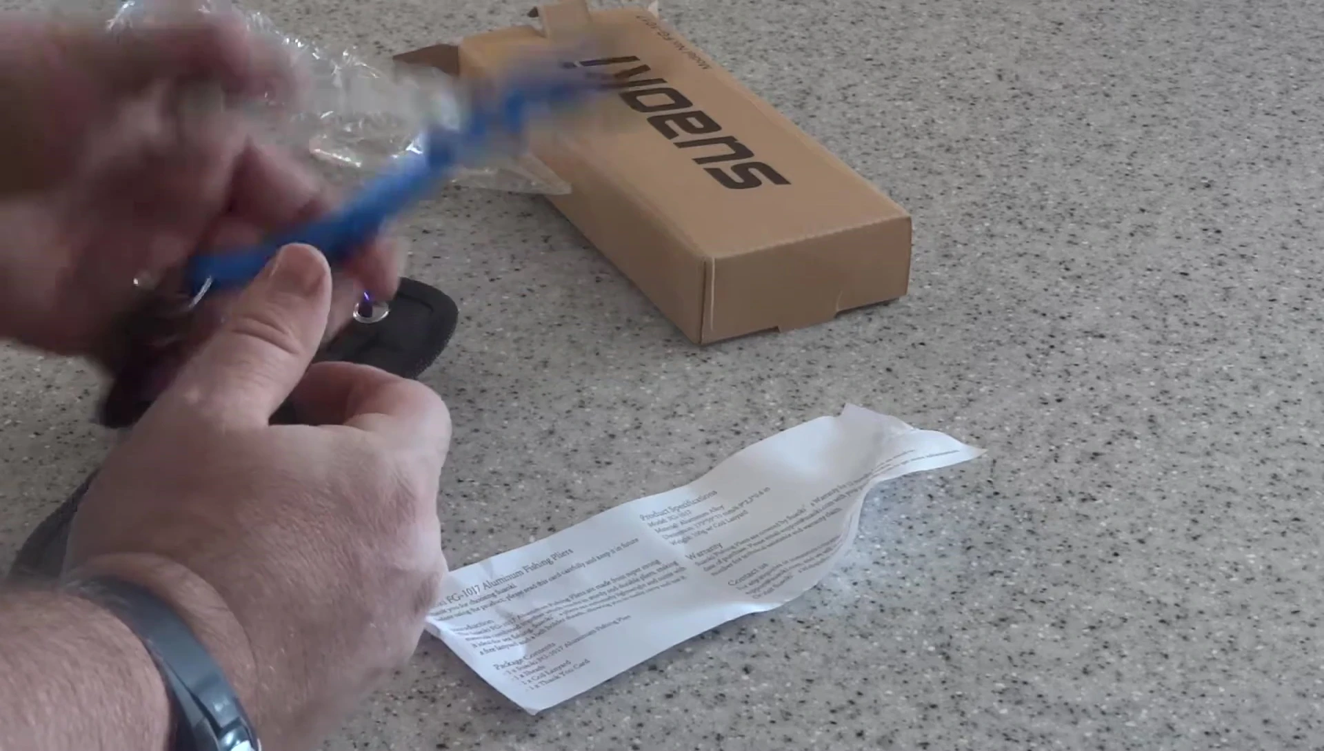Close-up of the pliers in hand