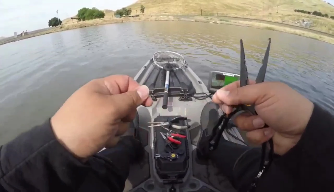 The pliers cutting through a single line of 50-pound braid.