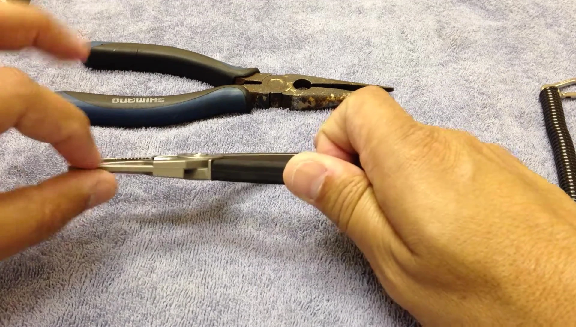Close-up of the pliers cutting braid.