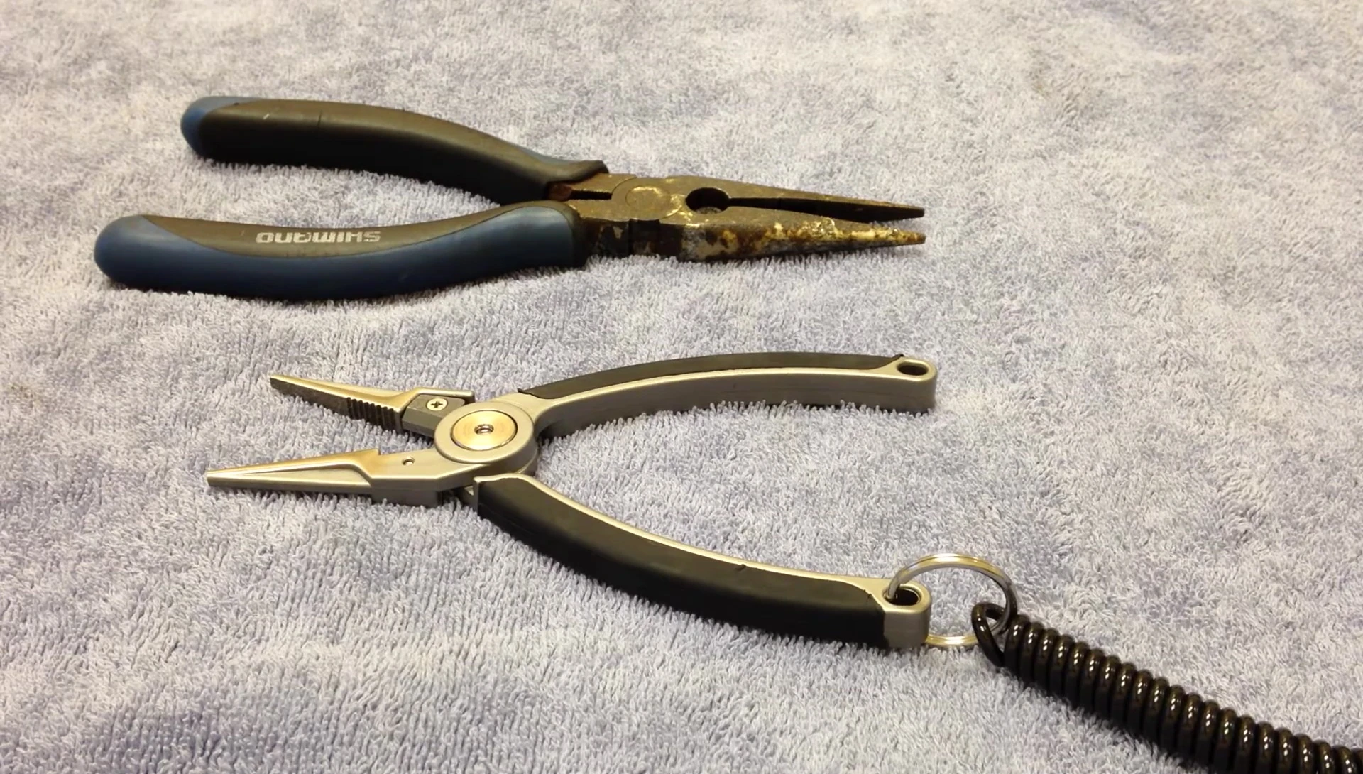 Close-up of the speaker mentioning his 12-year-old Van Staal pliers.
