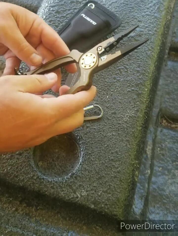 The line cutter on the pliers.