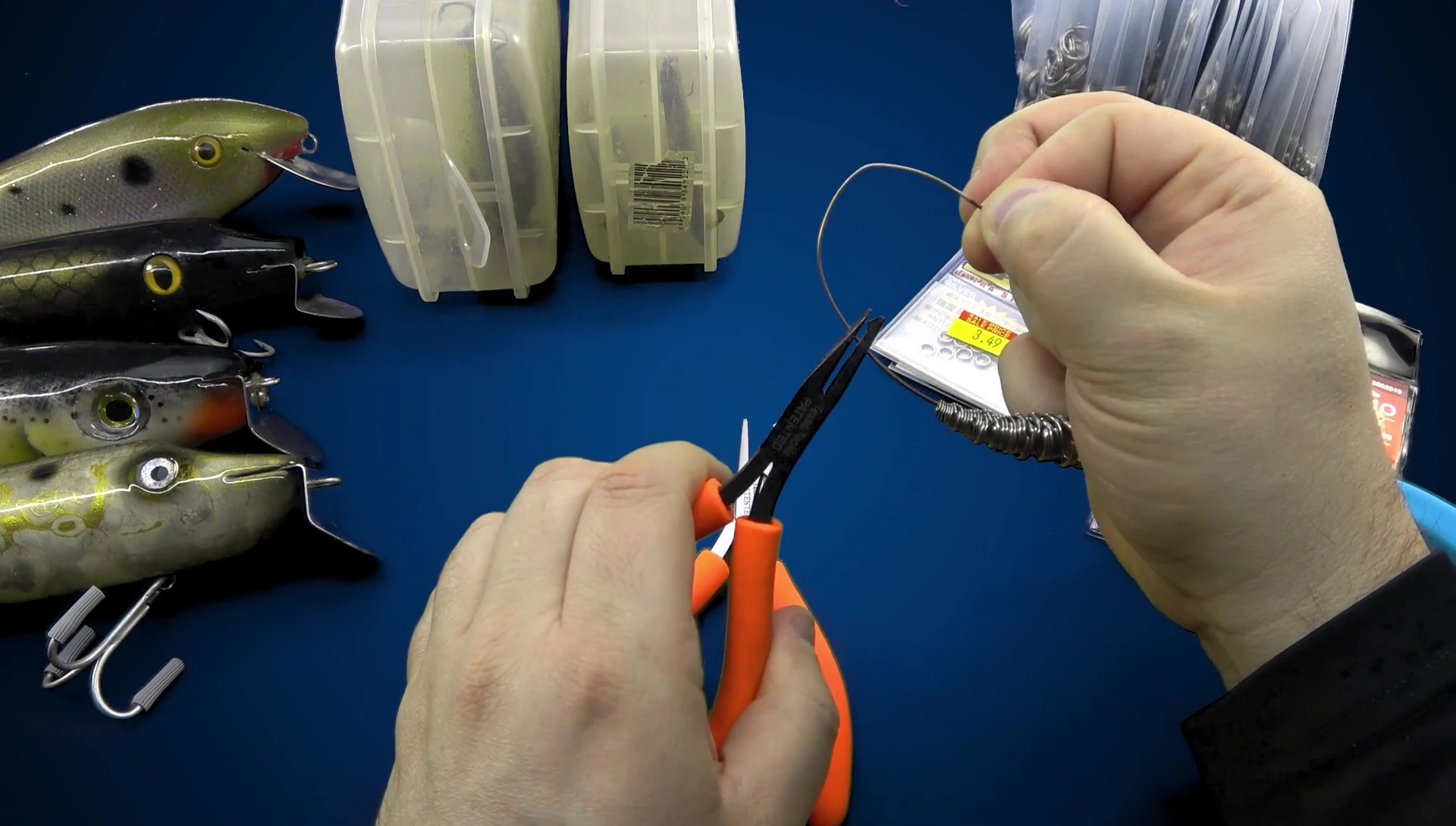Demonstration of the old pliers effortlessly handling a small split ring.
