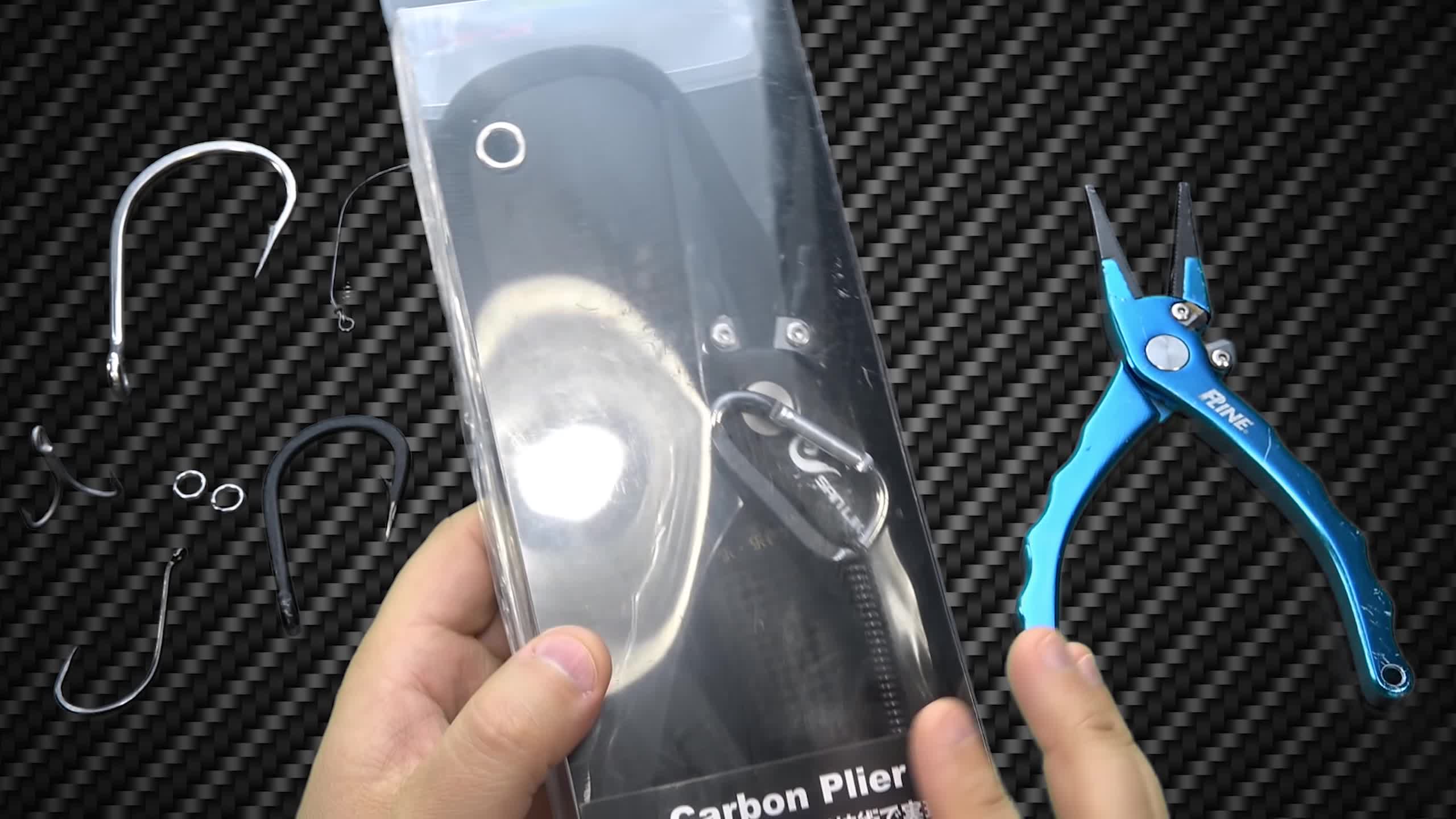 Close-up of the Sand-Like carbon fiber pliers in their packaging.
